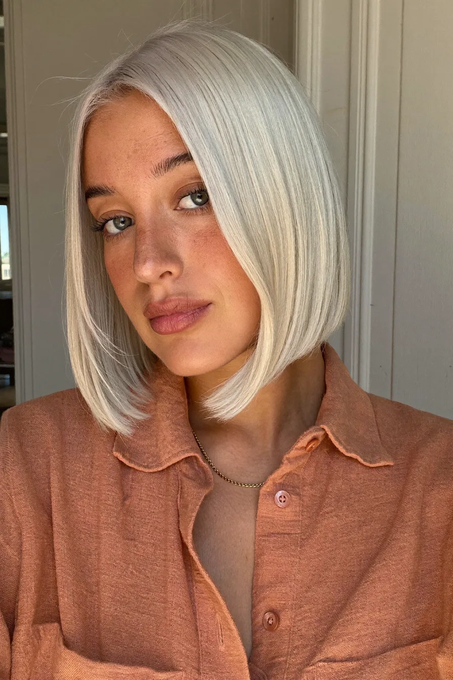 Sleek Platinum Bob Perfect for Cozy Fall Evenings