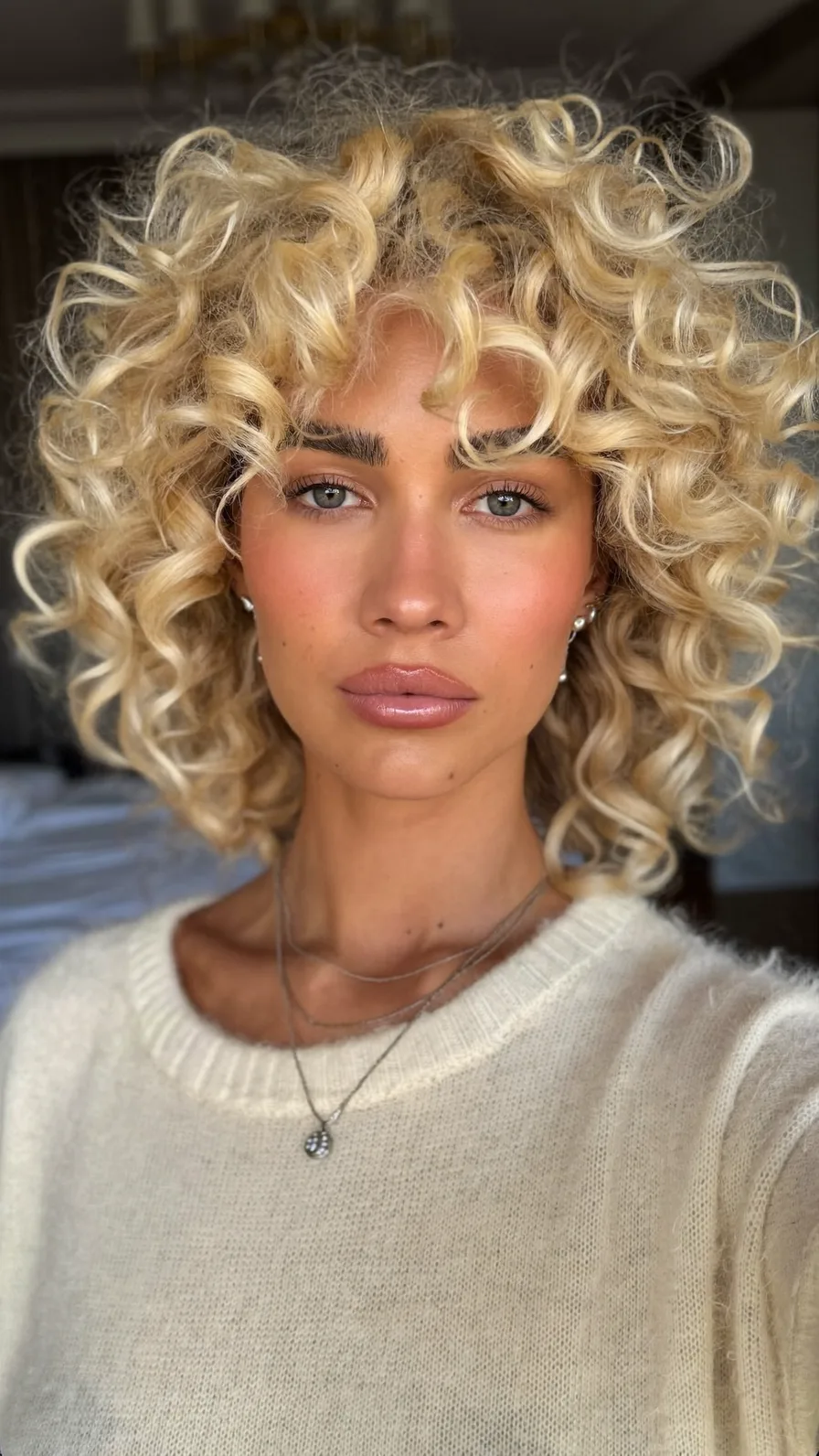 Voluminous Short Curly Bob with Center Curtain Bangs