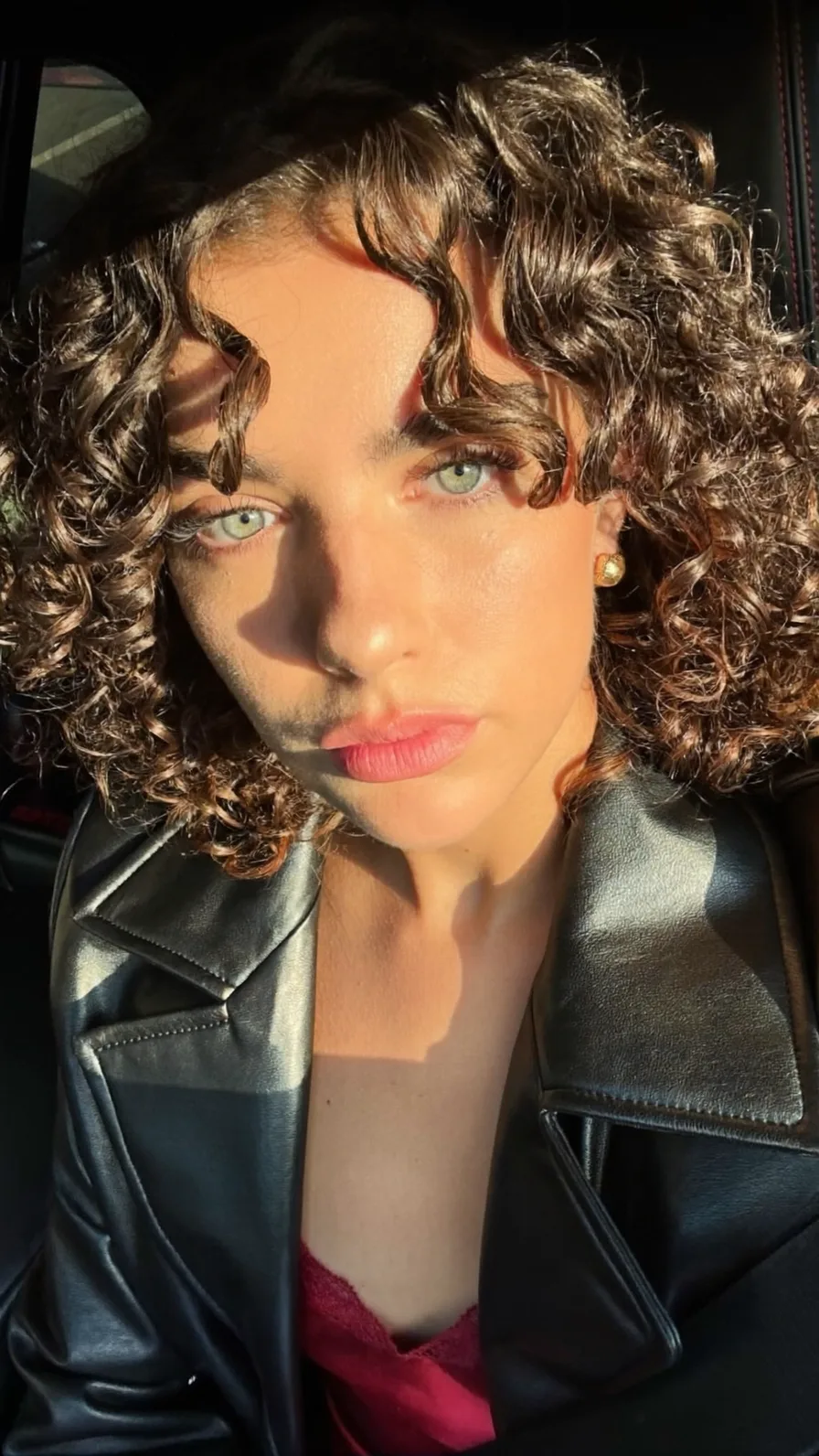 Voluminous Curly Chin-Length Bob with Center Curtain Bangs
