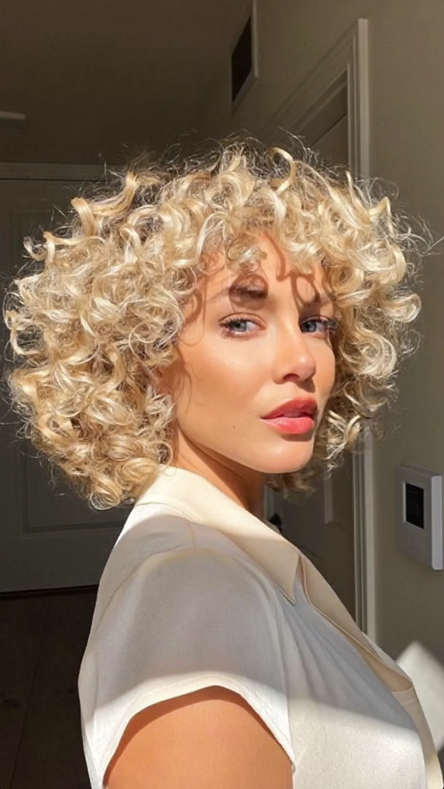 High-volume Curly Platinum Blonde Textured Bob Hairstyle
