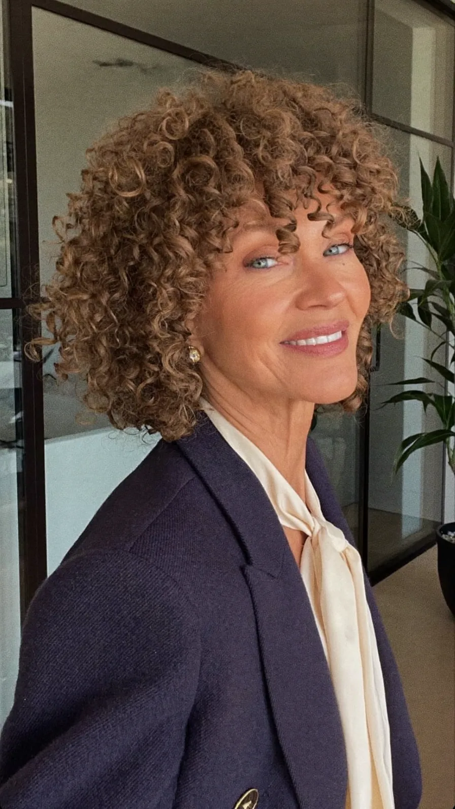 Elegant Curly Chin-Length Bob with Soft Curtain Bangs