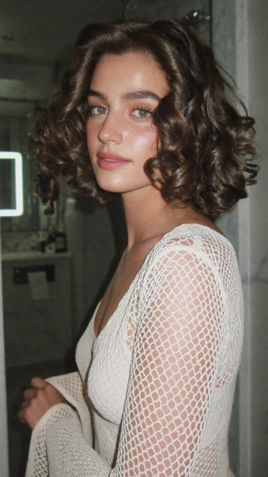 Chin-Length Voluminous Curly Bob with Blunt Cut