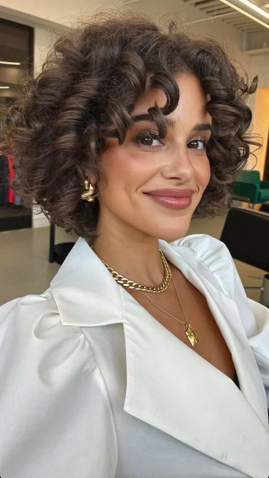 Voluminous Curly Chin-Length Bob With Rounded Ends