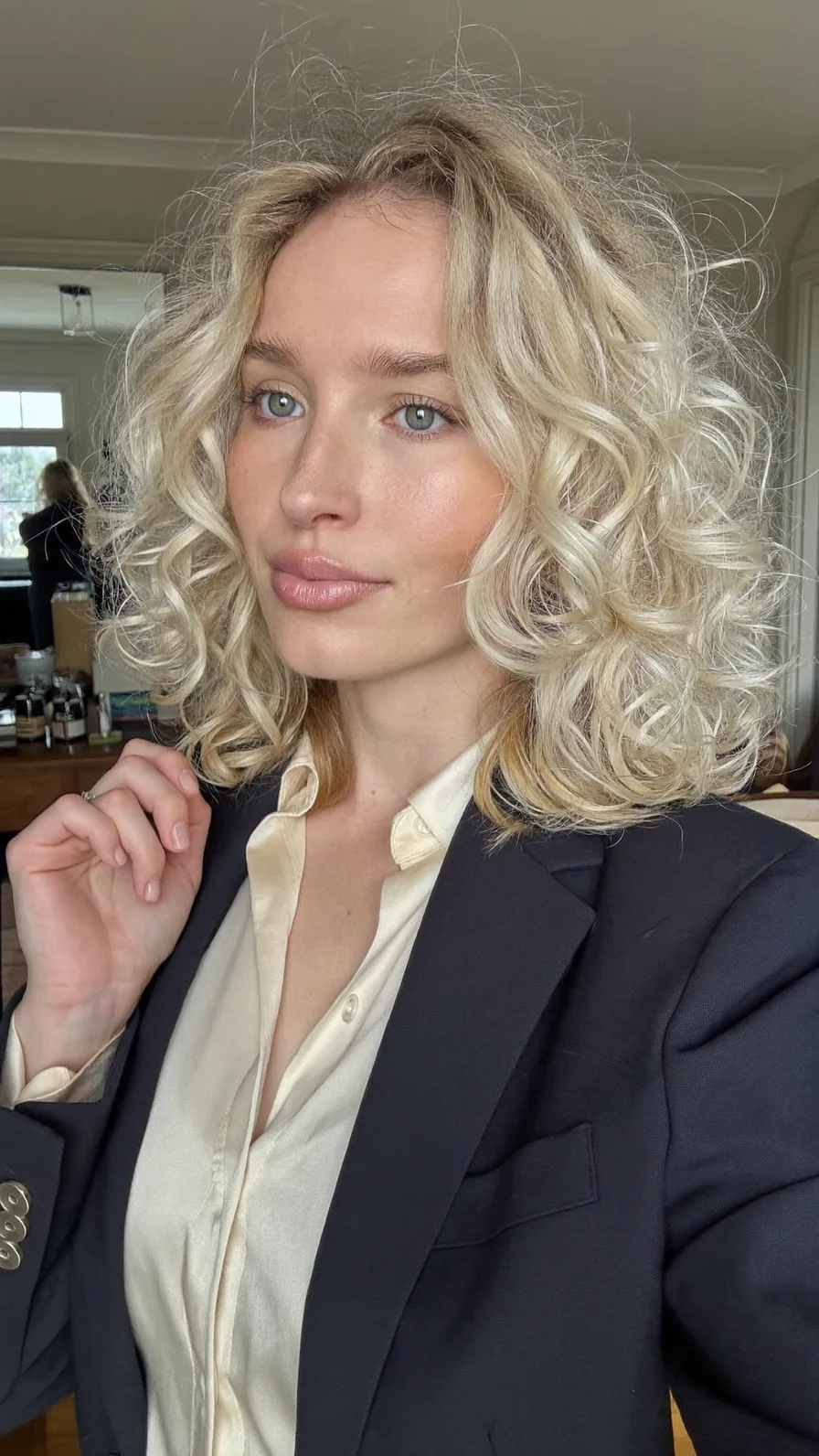 Voluminous Curly Platinum Blonde Shoulder-Length Bob Style