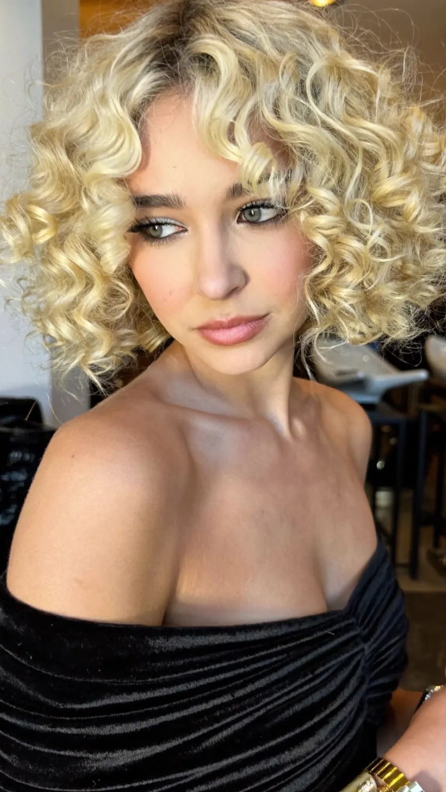 Voluminous Curly Bob with Center-Parted Curtain Bangs
