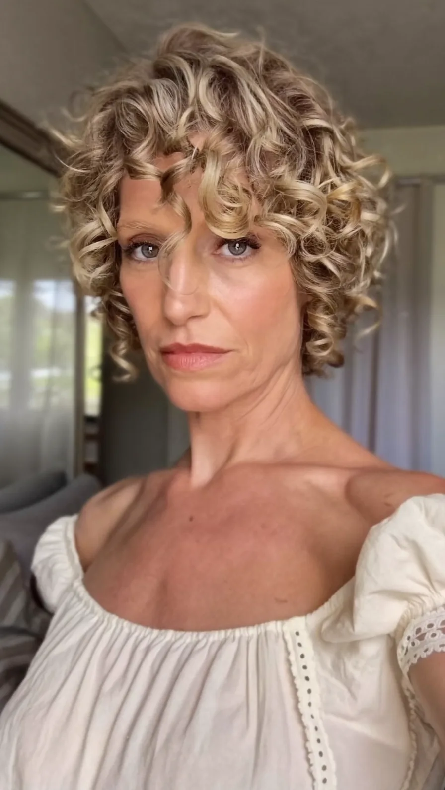 Modern Curly Bob with Curtain Bangs and Choppy Layers