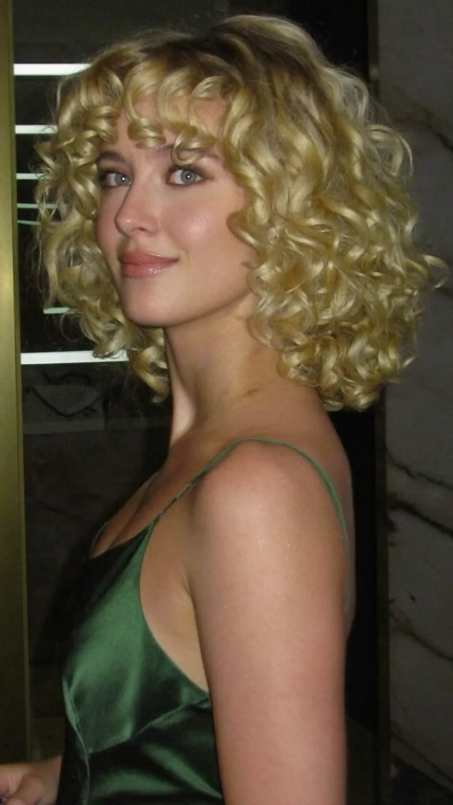Voluminous Curly Golden Blonde Bob with Curtain Bangs