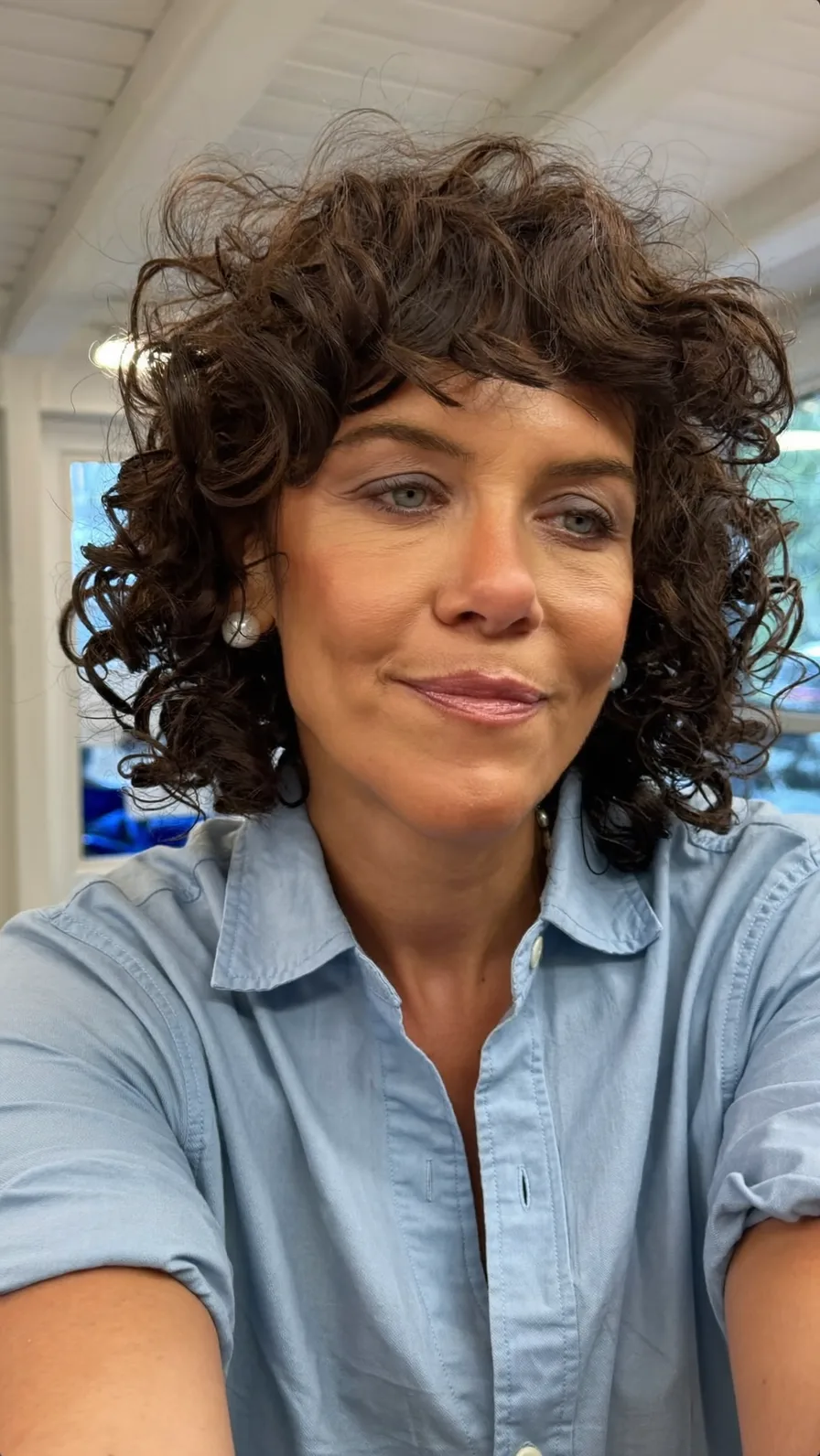 Voluminous Curly Bob with Soft Curtain Bangs