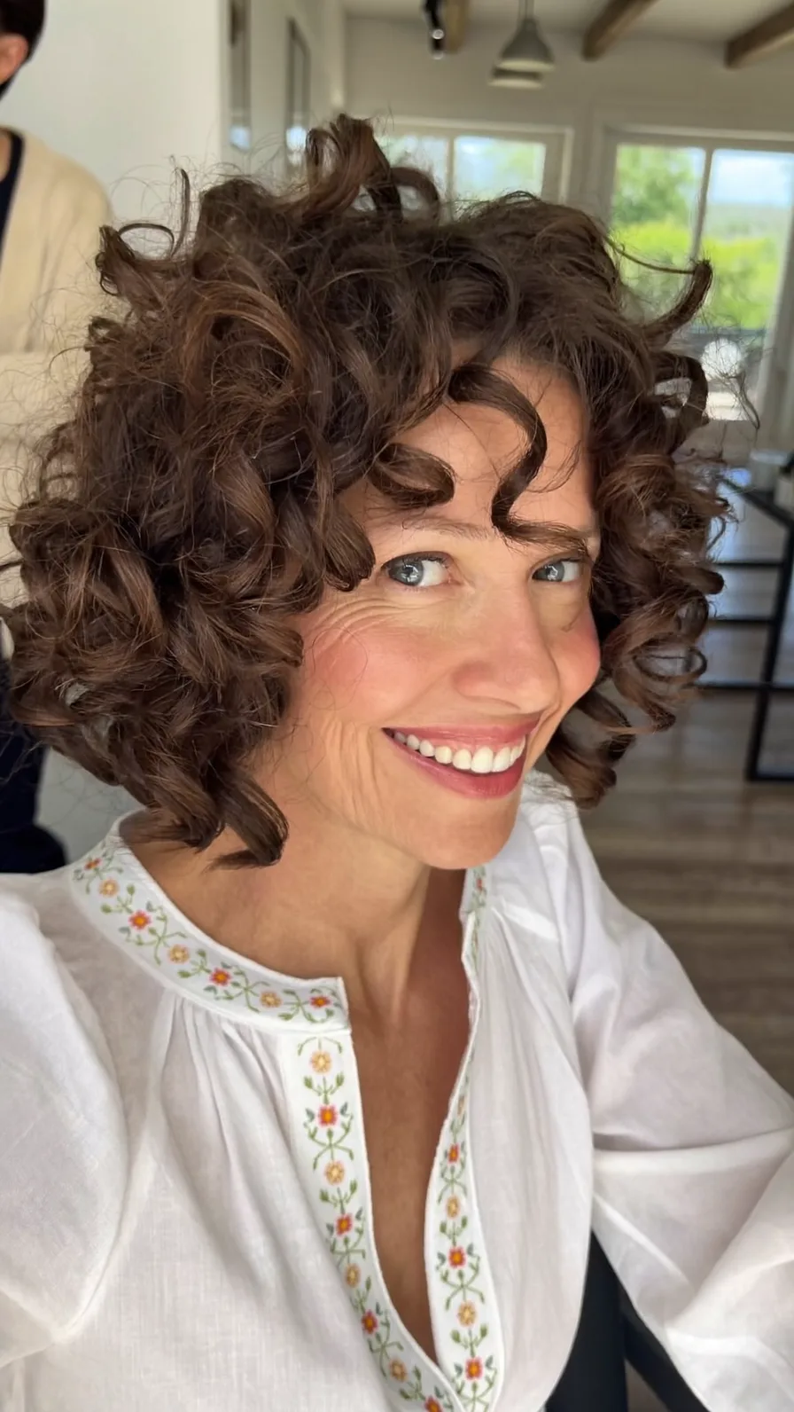 Voluminous Curly Chin-Length Bob with Rounded Ends