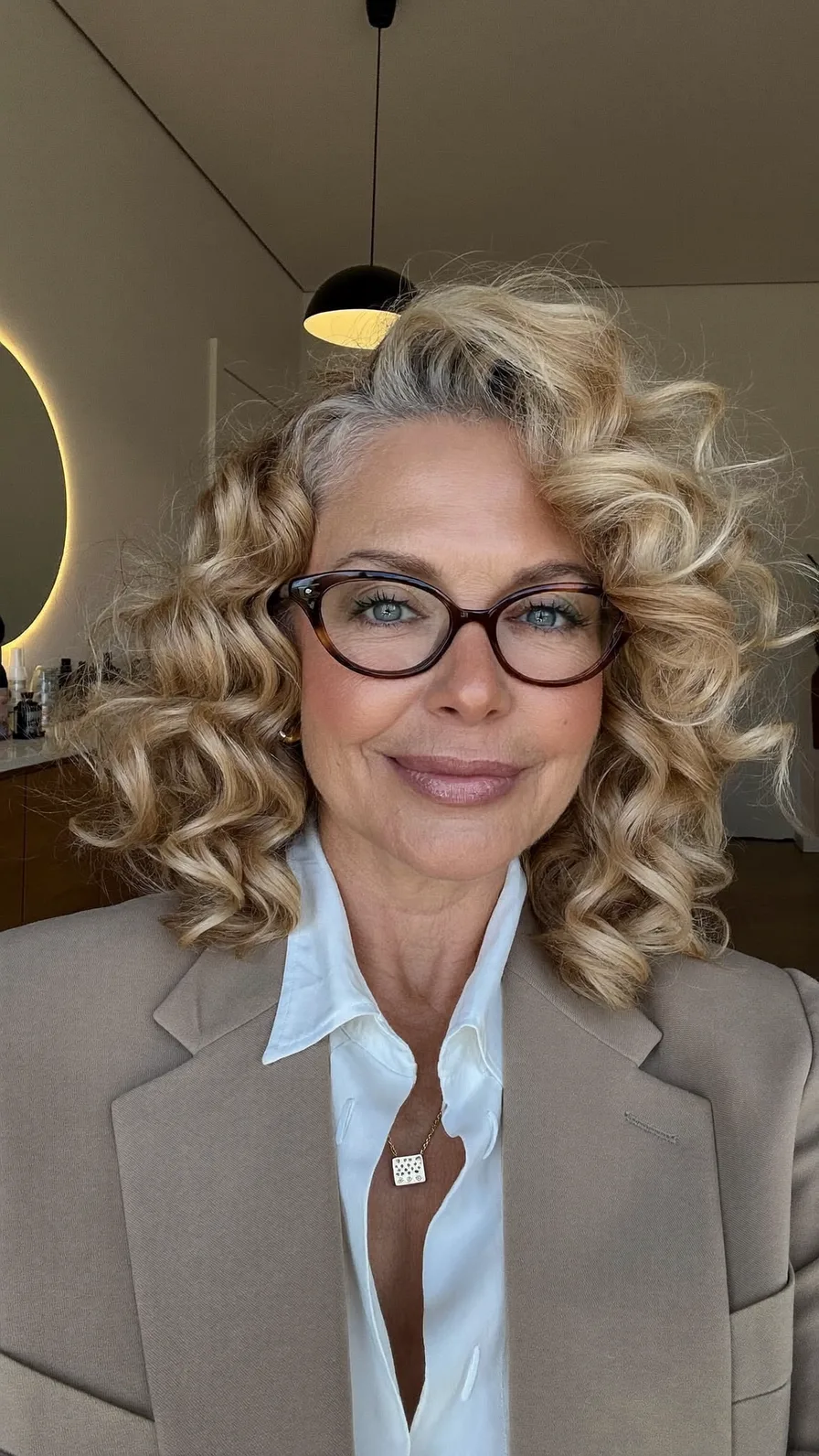 Voluminous Honey Blonde Curly Shoulder-Length Style