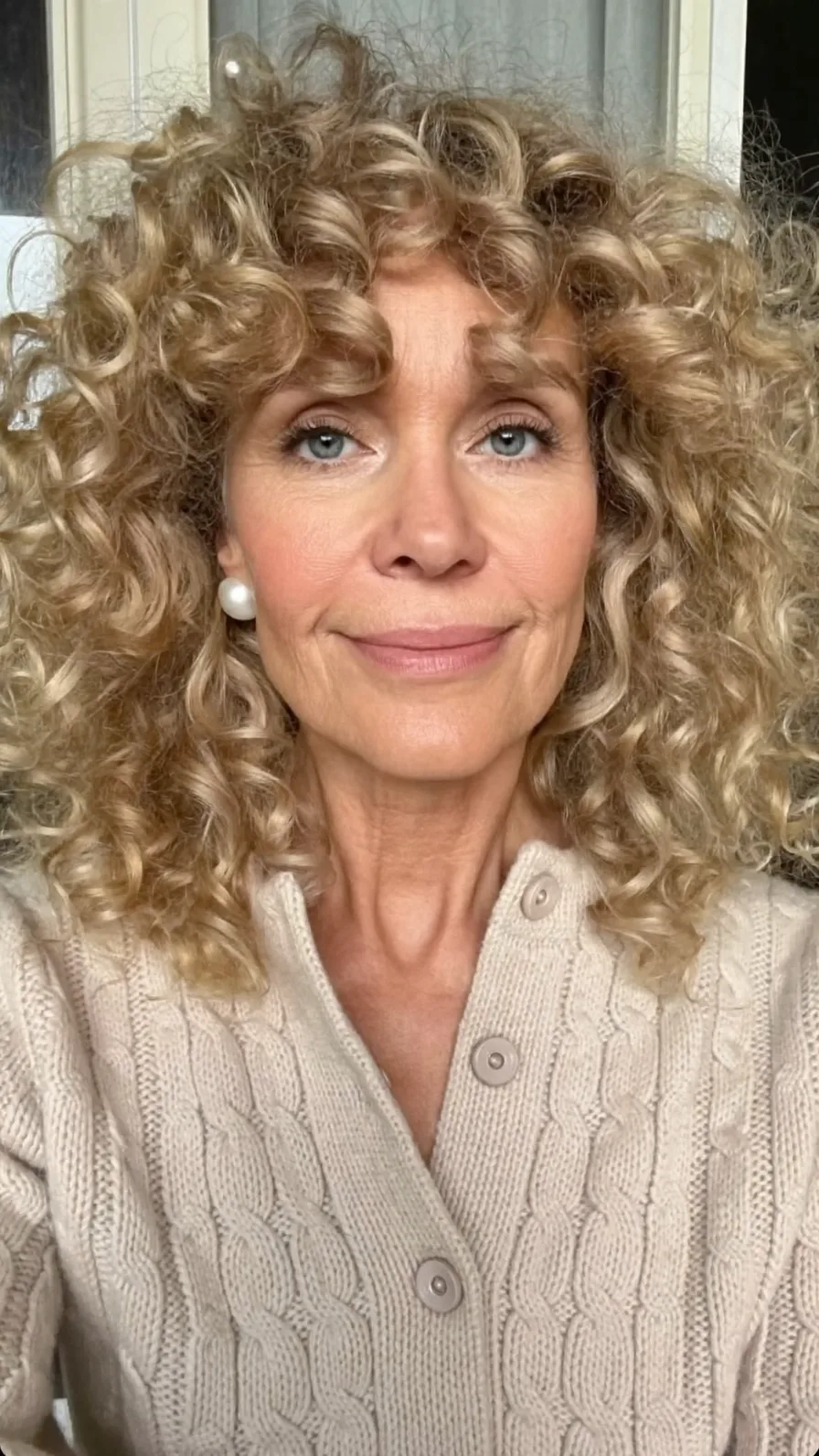 Voluminous Shoulder-Length Curly Layers with Warm Blonde Balayage