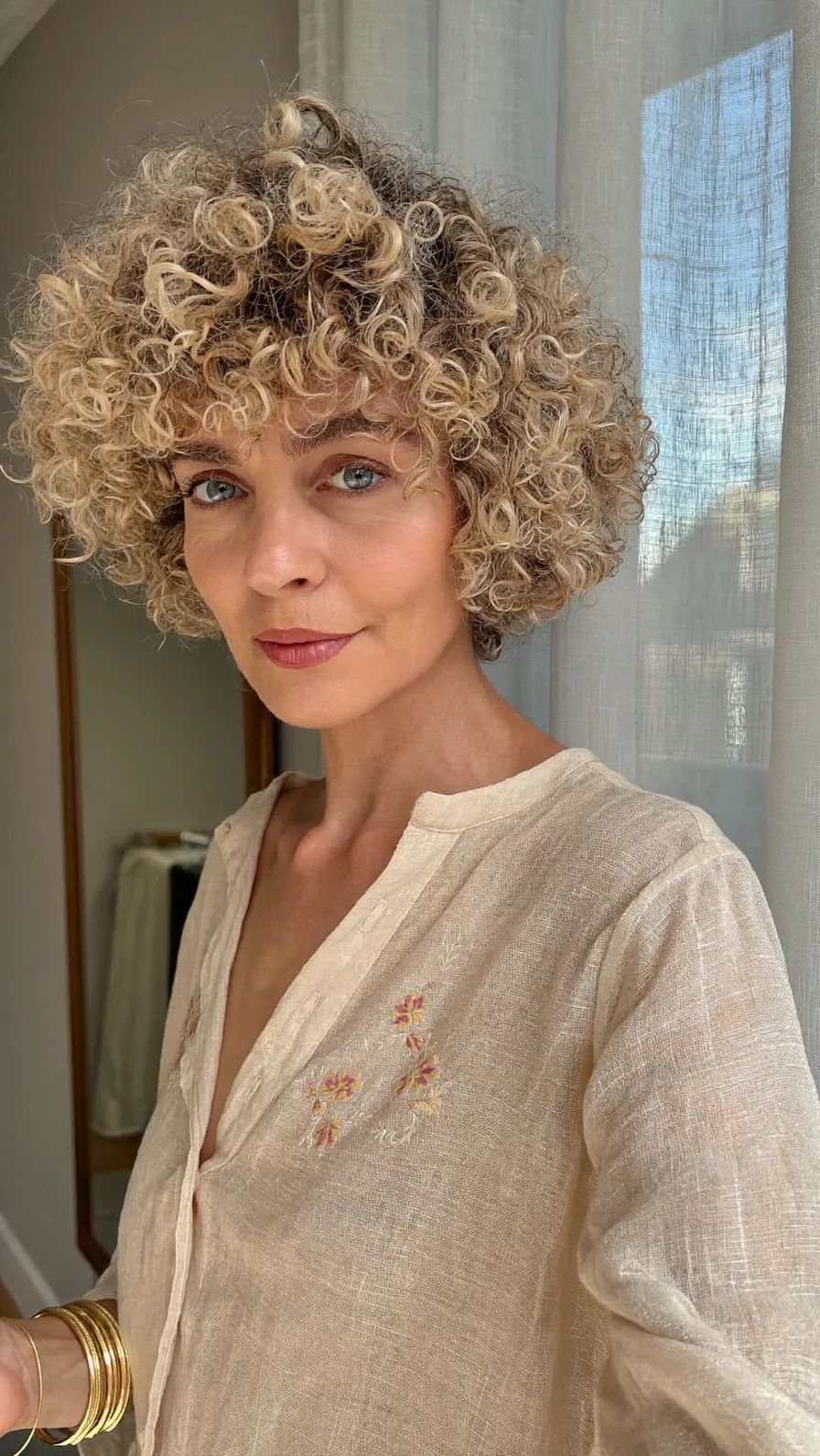 Voluminous Curly Bob with Warm Honey Blonde Balayage