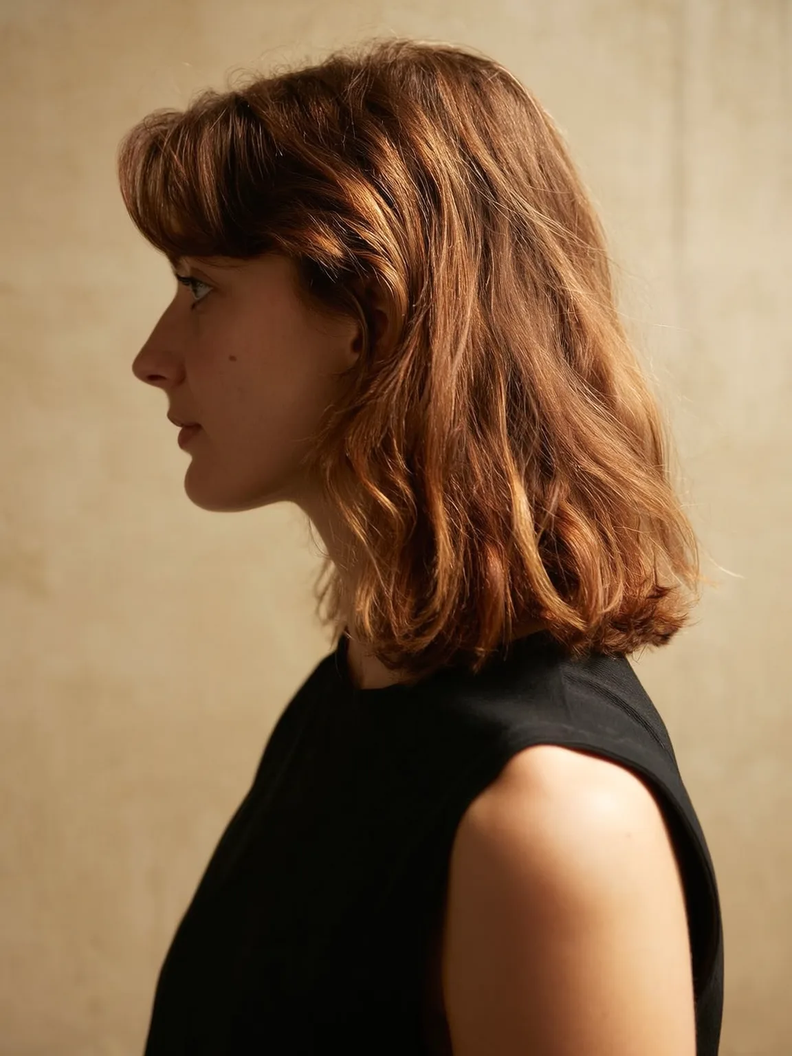 Warm Caramel Brown Wavy Shoulder-Length Lob with Curtain Bangs