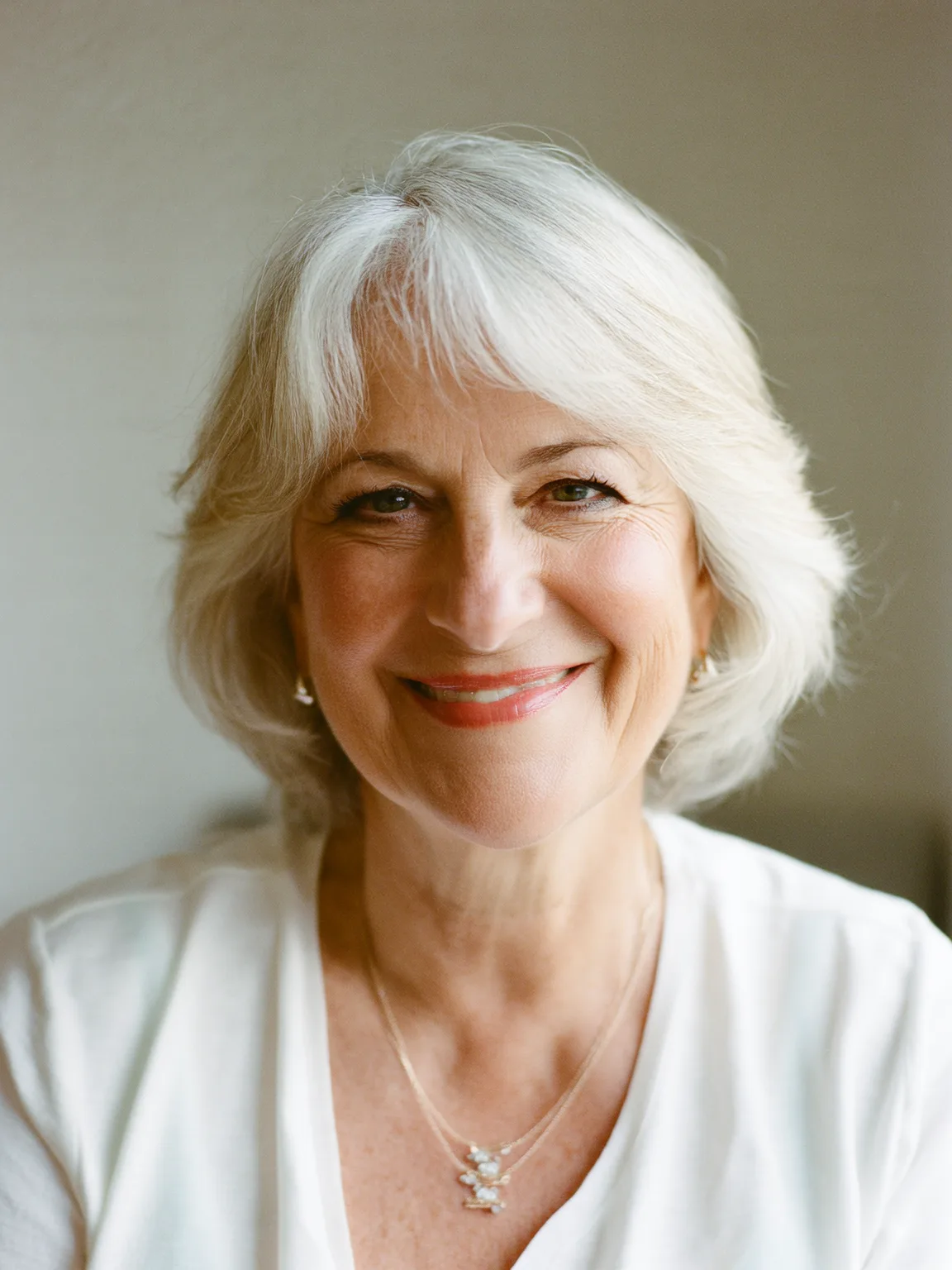 Silver Frost Wavy Bob with Curtain Bangs and Medium Volume