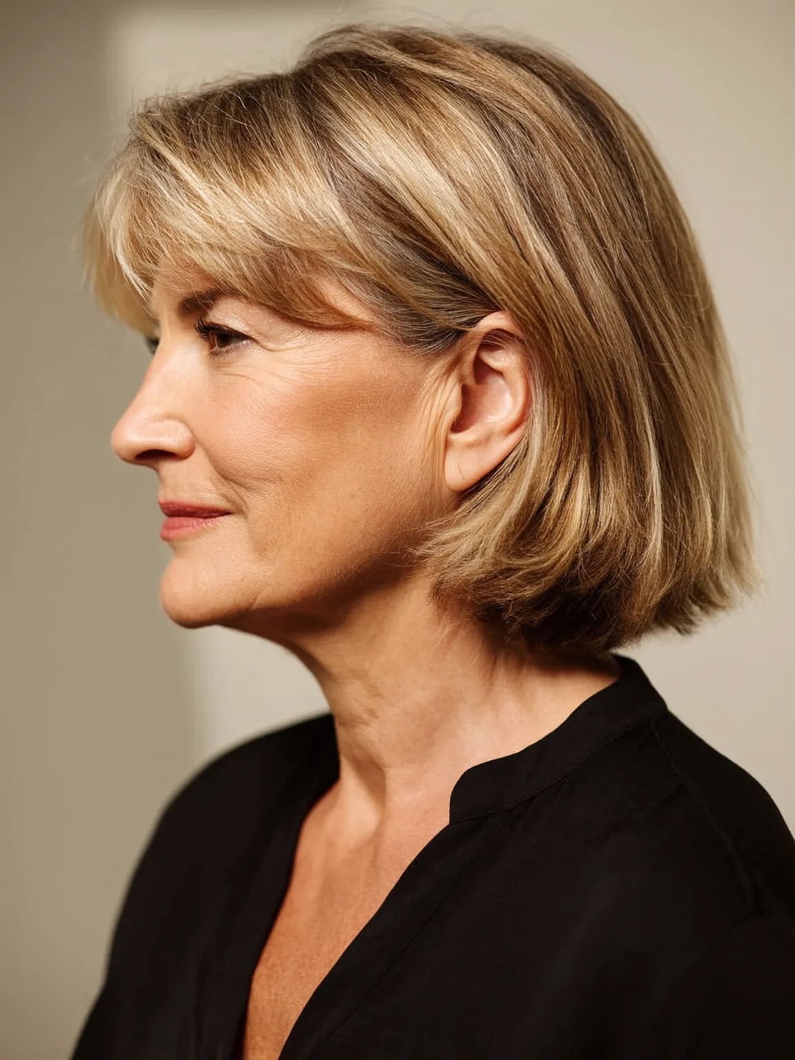 Straight Chin-Length Sandy Blonde Bob with Subtle Highlights