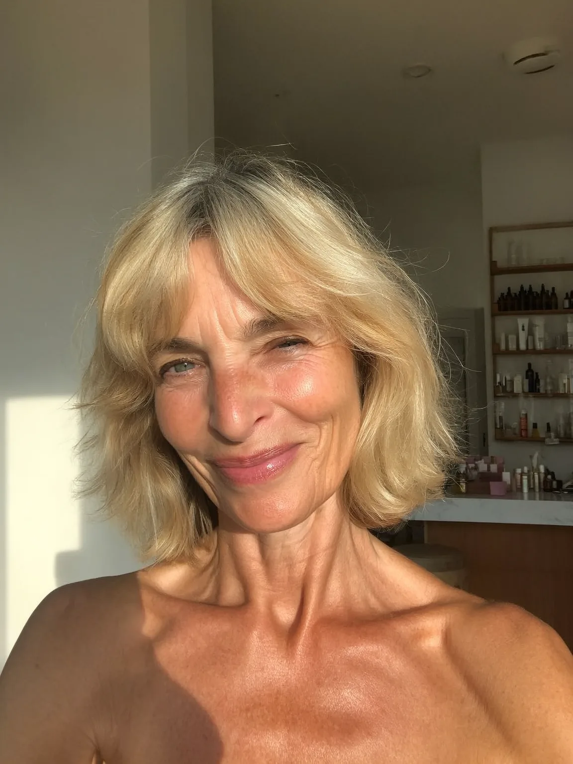 Shoulder-Length Wavy Soft Sandy Blonde Bob with Curtain Bangs