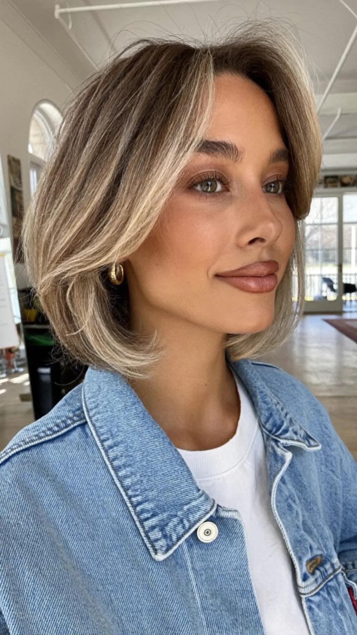 Sleek Straight Dark Blonde Bob with Curtain Bangs and Balayage