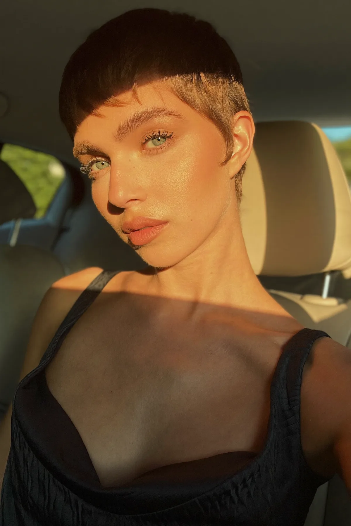 Sleek Straight Dark Blonde Pixie Cut with Full Fringe Bangs