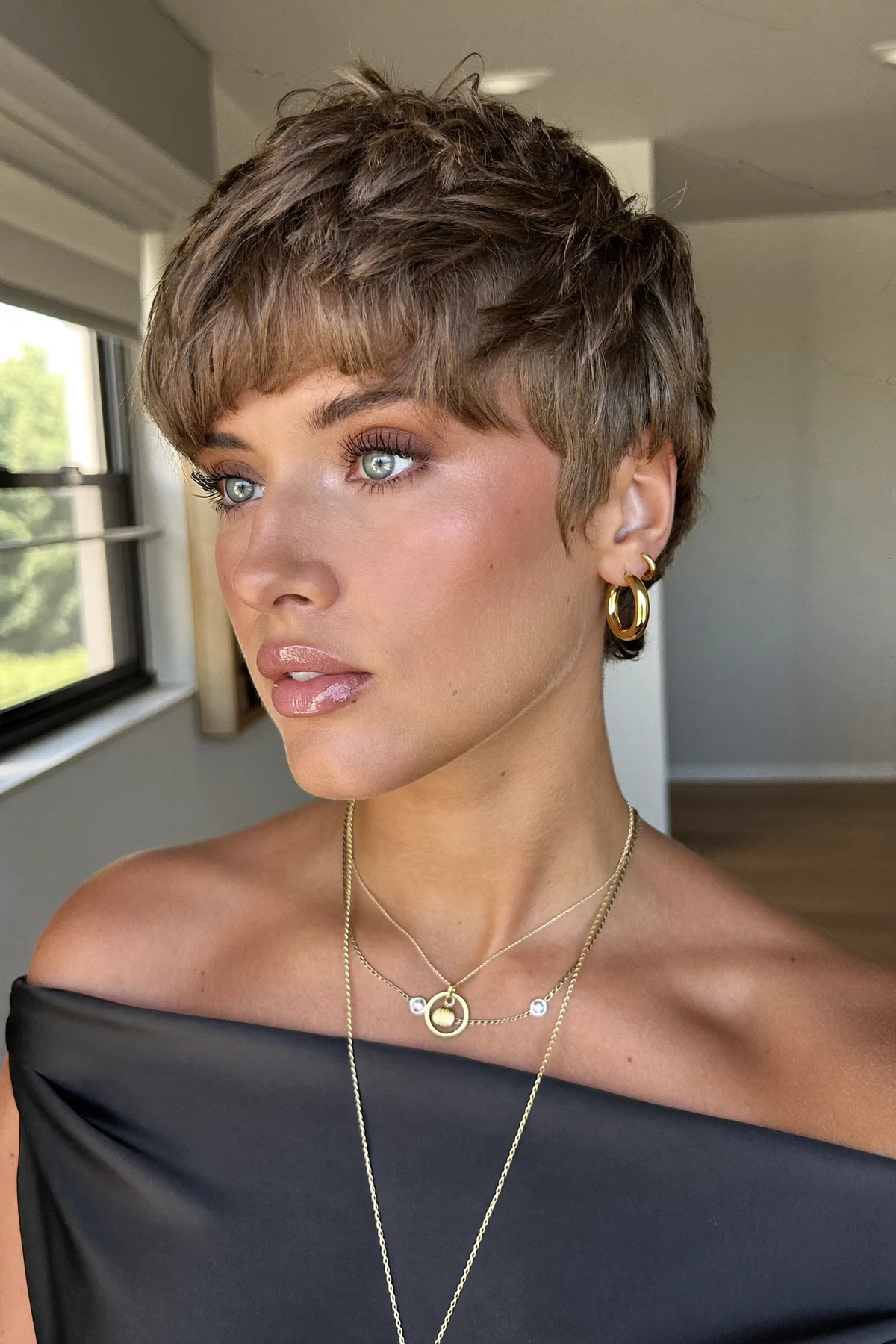 Textured Wavy Pixie Cut with Full Fringe in Dark Blonde