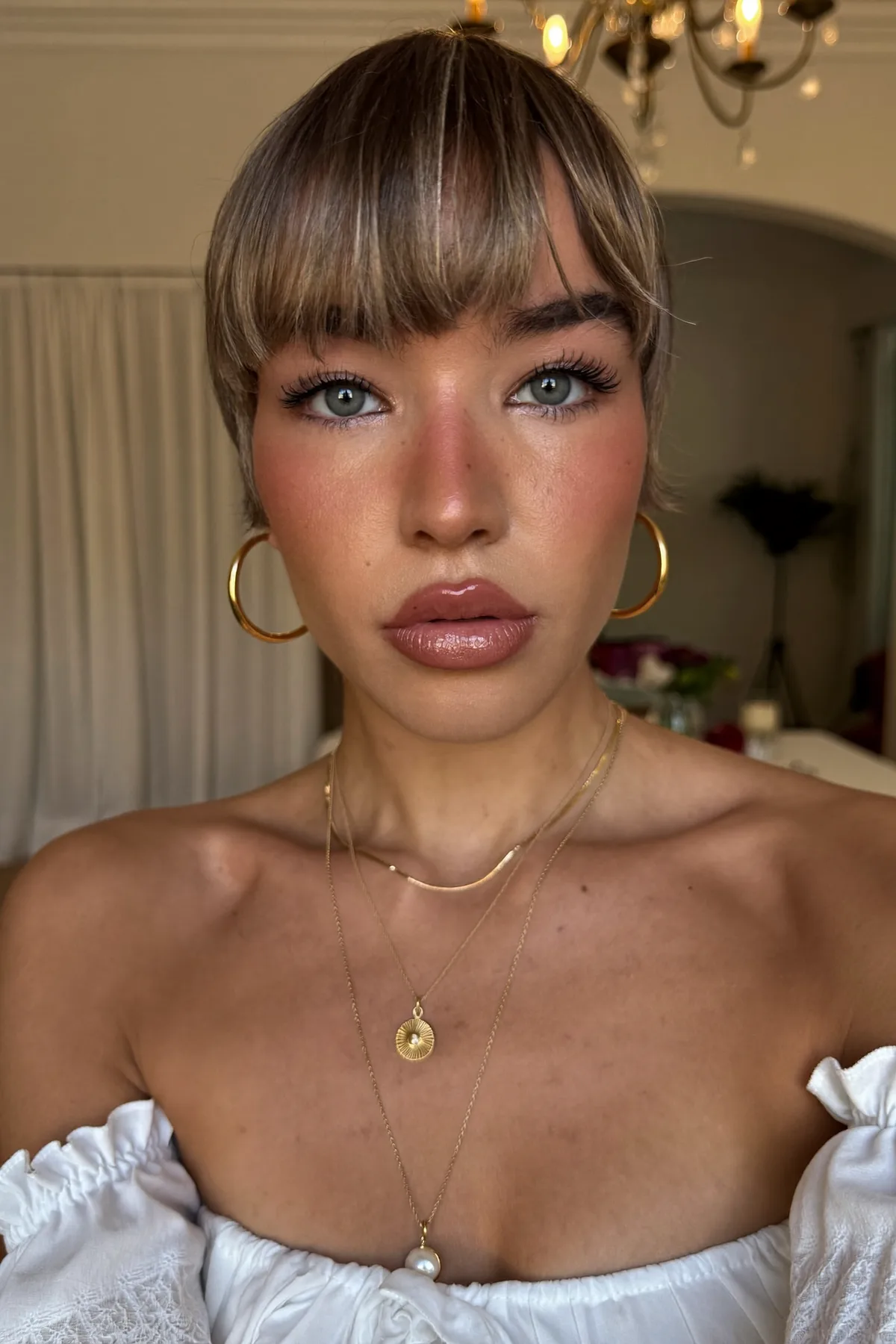 Sleek Straight Dark Blonde Pixie Cut with Curtain Bangs