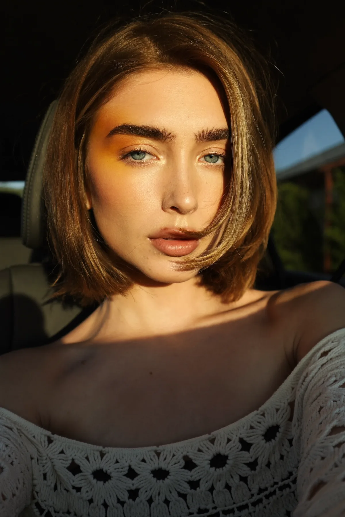 Sleek Straight Dark Blonde Chin-Length Bob with Solid Color Finish