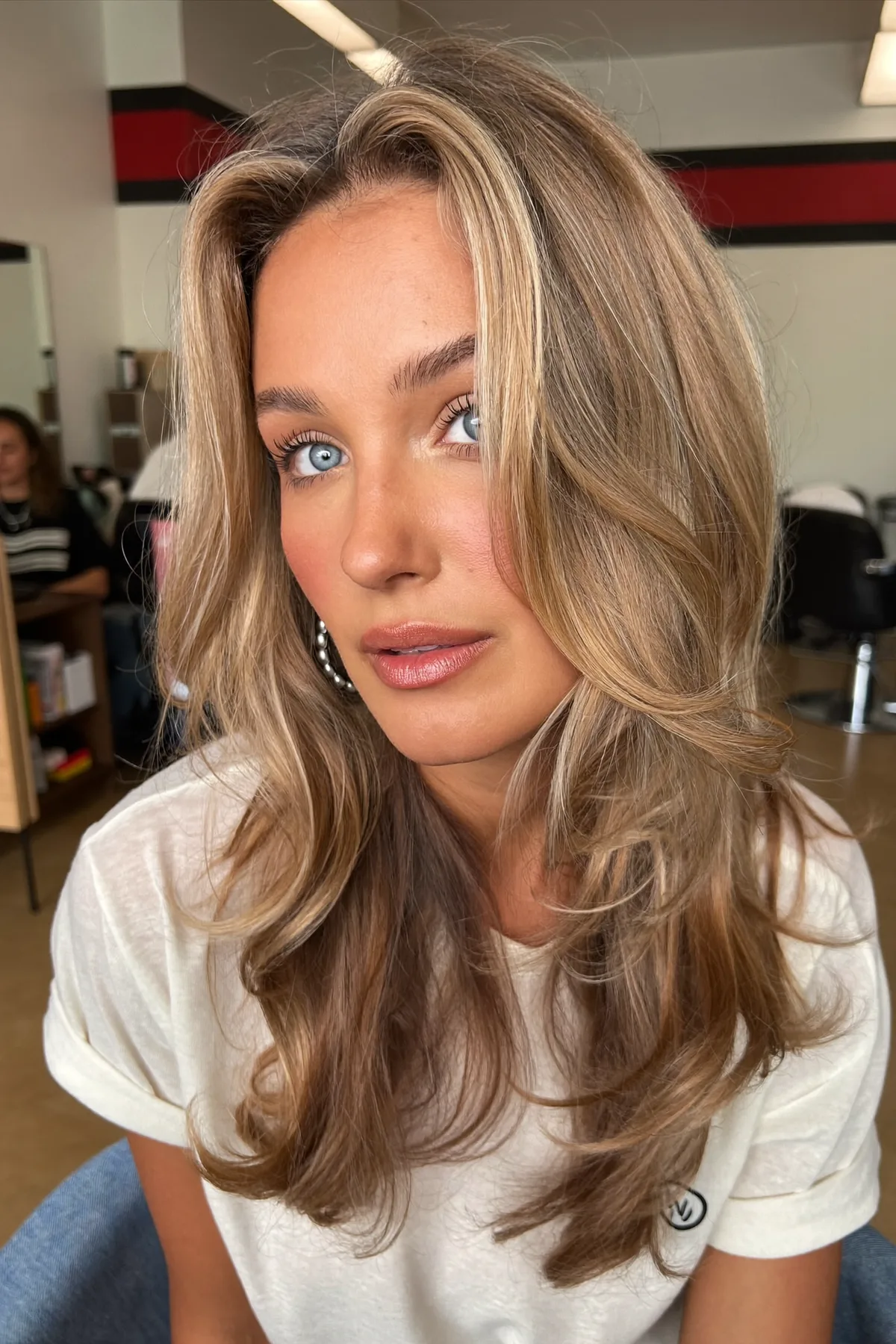 Mid-Back Long Layered Cut with Dark Blonde Balayage Waves