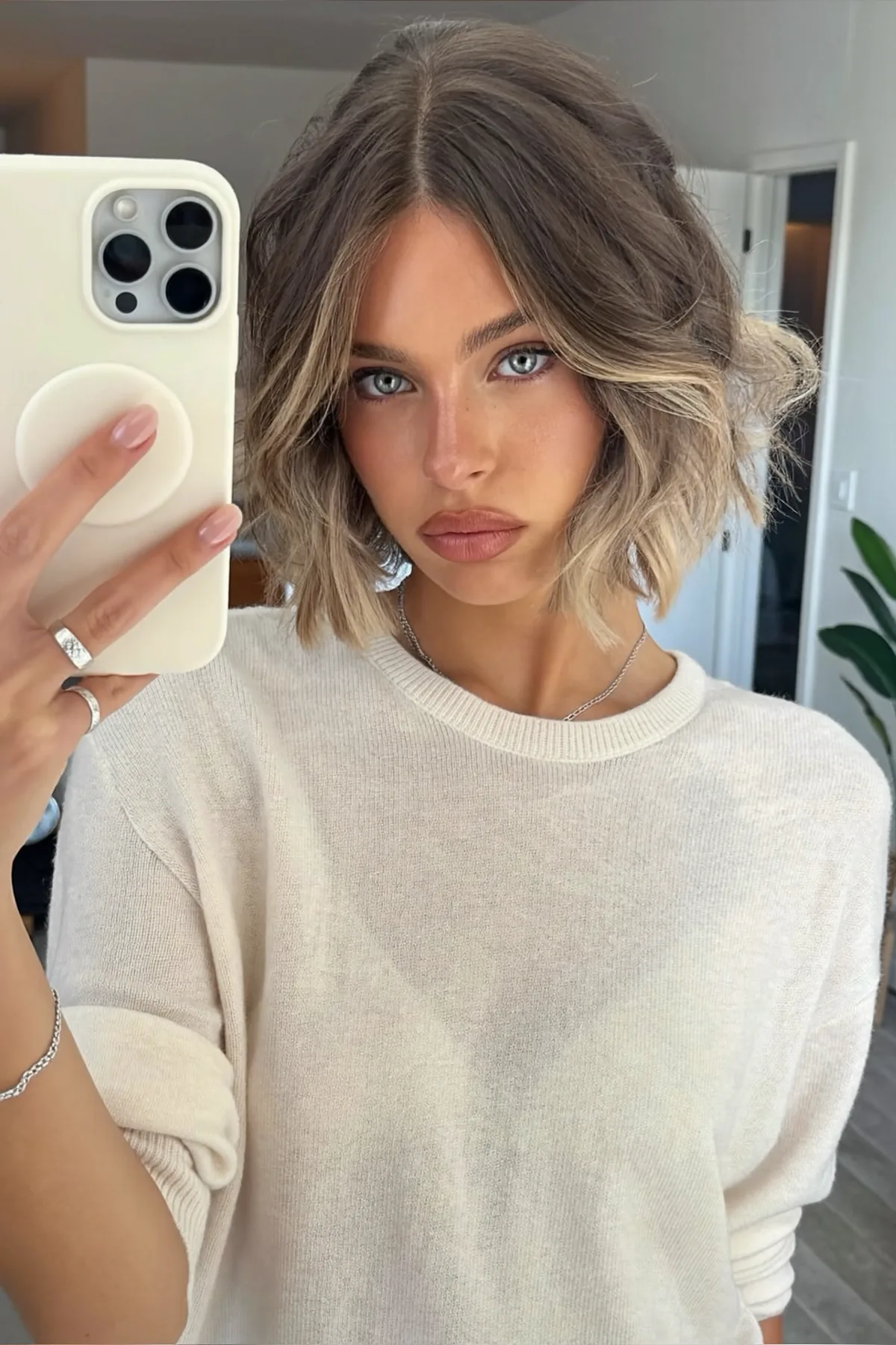 Chin-Length Wavy Bob in Dark Blonde with Money-Piece Color Melt