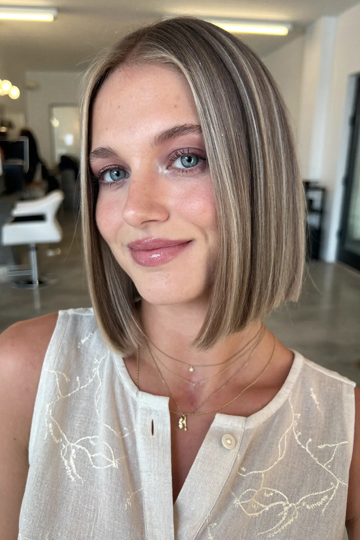 Sleek Straight Dark Blonde Chin-Length Bob With Blended Balayage