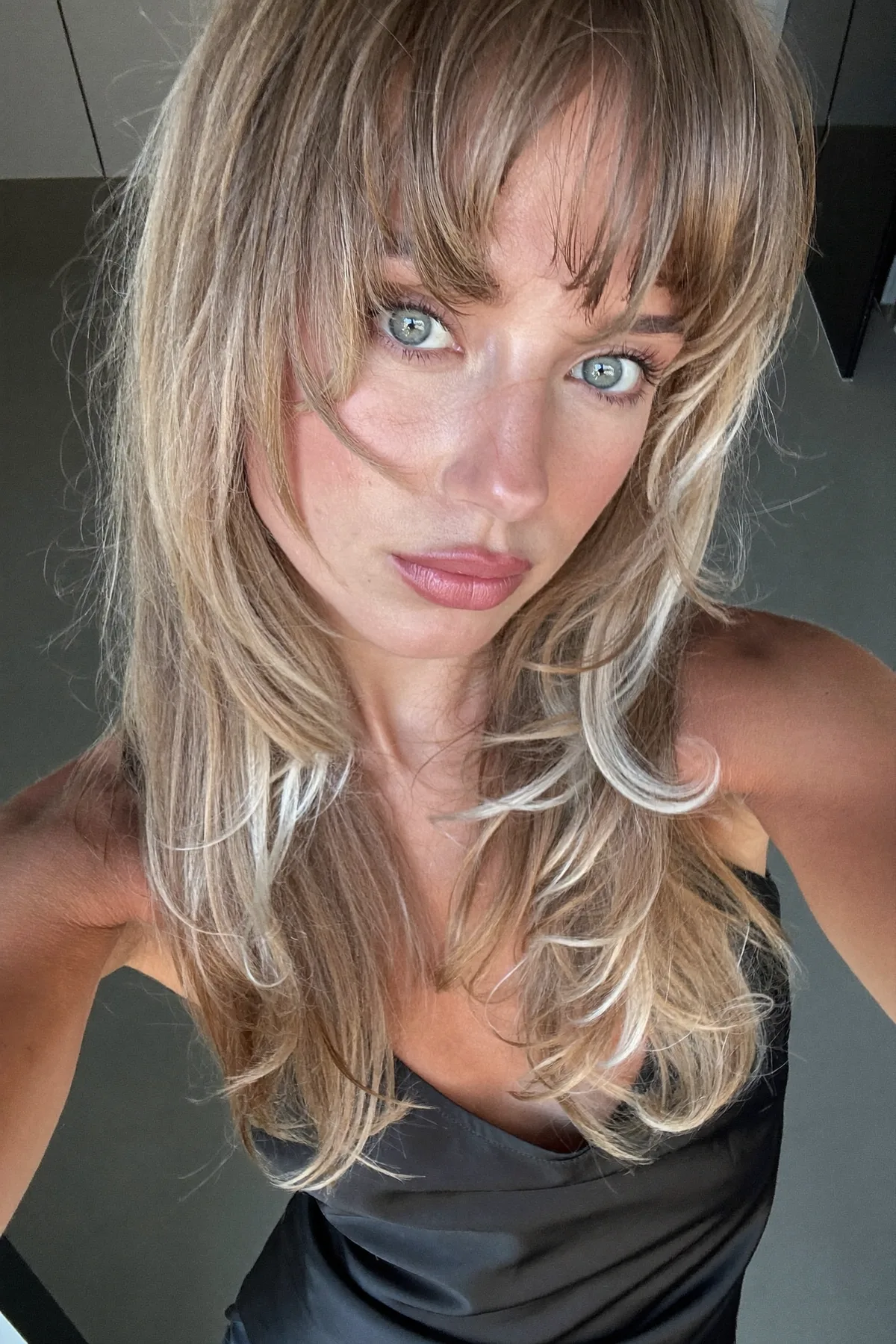 Mid-Back Long Layered Cut in Solid Dark Blonde with Curtain Bangs
