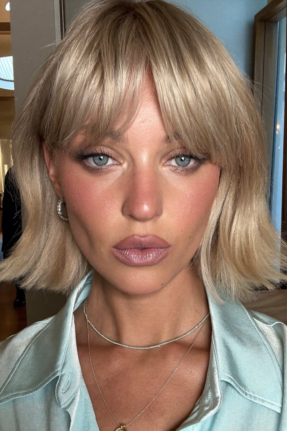 Sleek Straight Dark Blonde Chin-Length Bob with Full Fringe Bangs