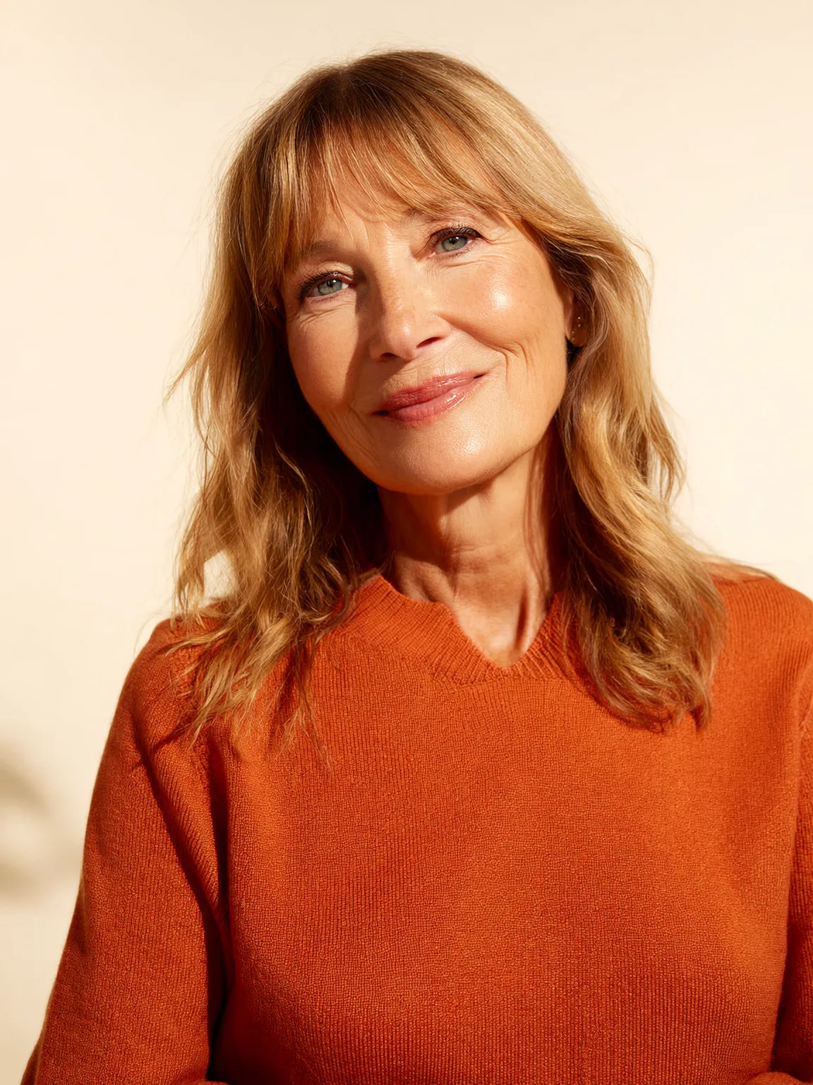 Soft Flowing Layers with Curtain Bangs in Sandy Blonde