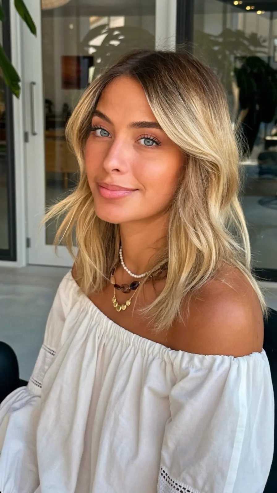 Shoulder-Length Honey Blonde Balayage with Feathered Layers