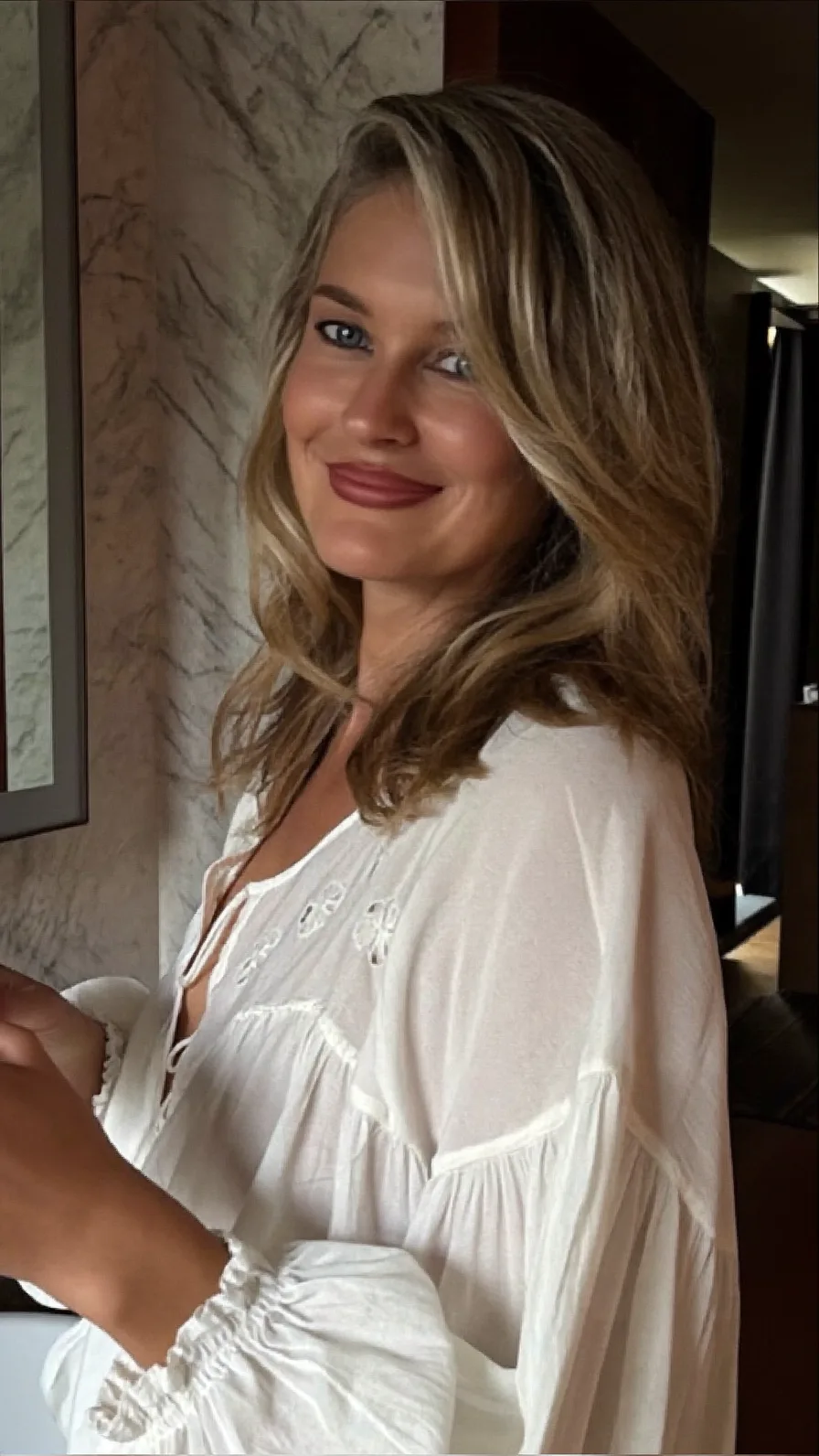 Flowing Medium-Length Dark Blonde Hair with Honey Balayage Highlights
