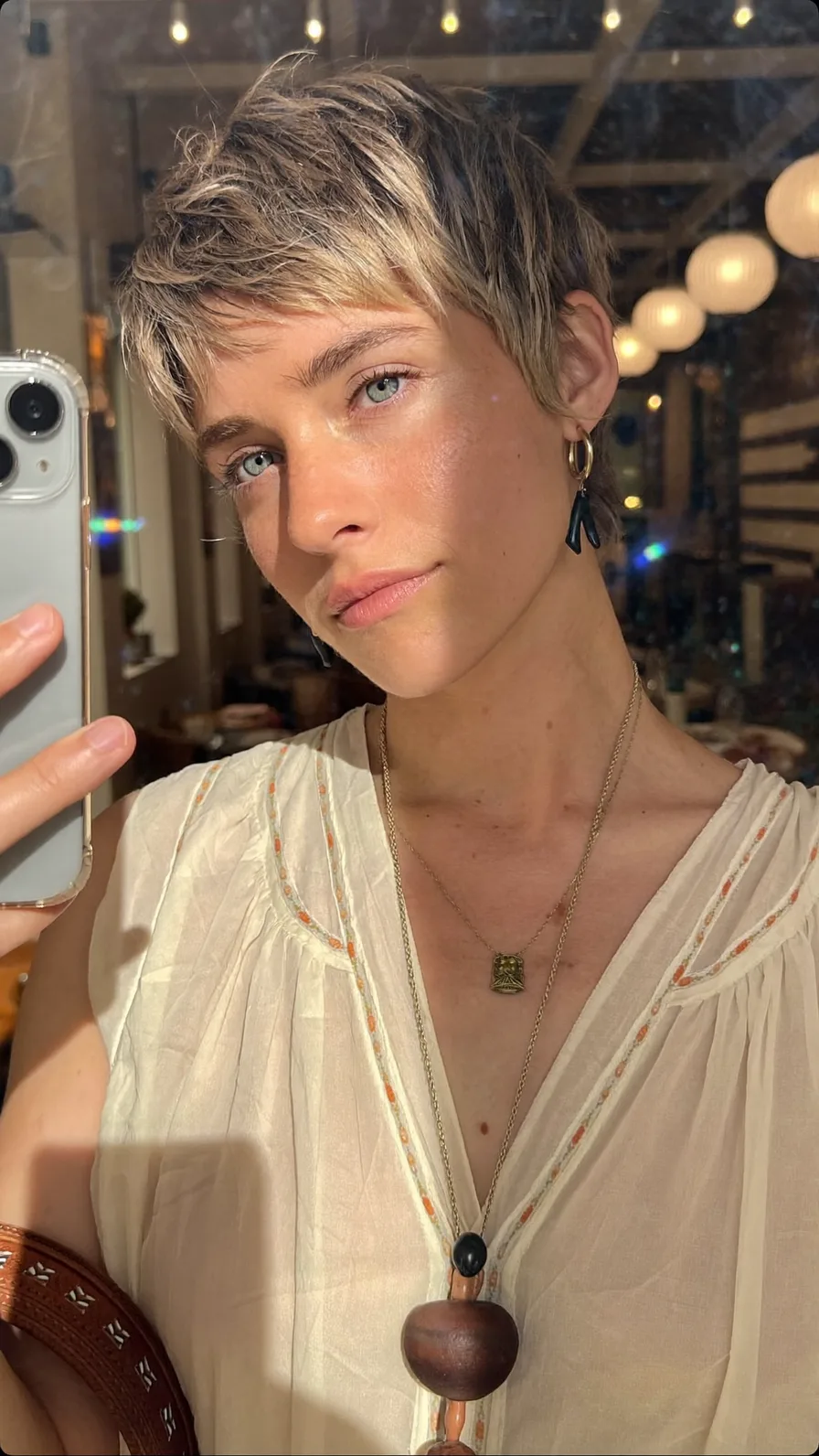 Modern Textured Pixie Cut with Wispy Blonde Highlights