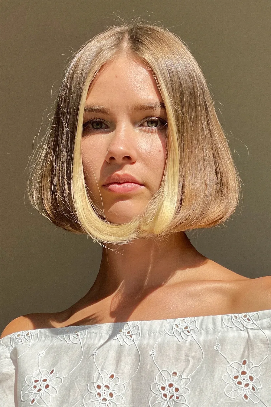 Chin-Length Blunt Bob with Face-Framing Blonde Highlights