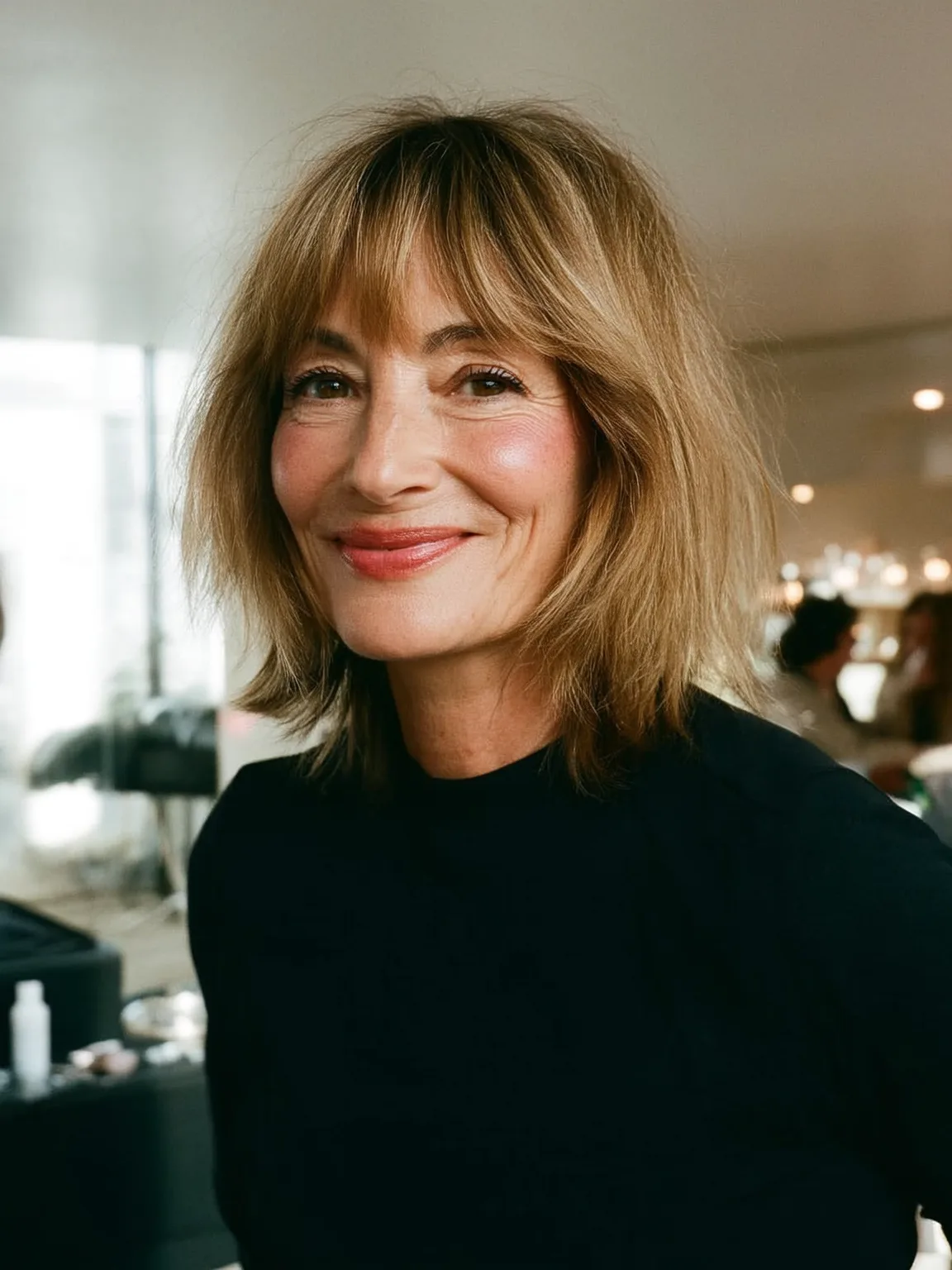 Shoulder-Length Straight Sandy Blonde Shag with Curtain Bangs