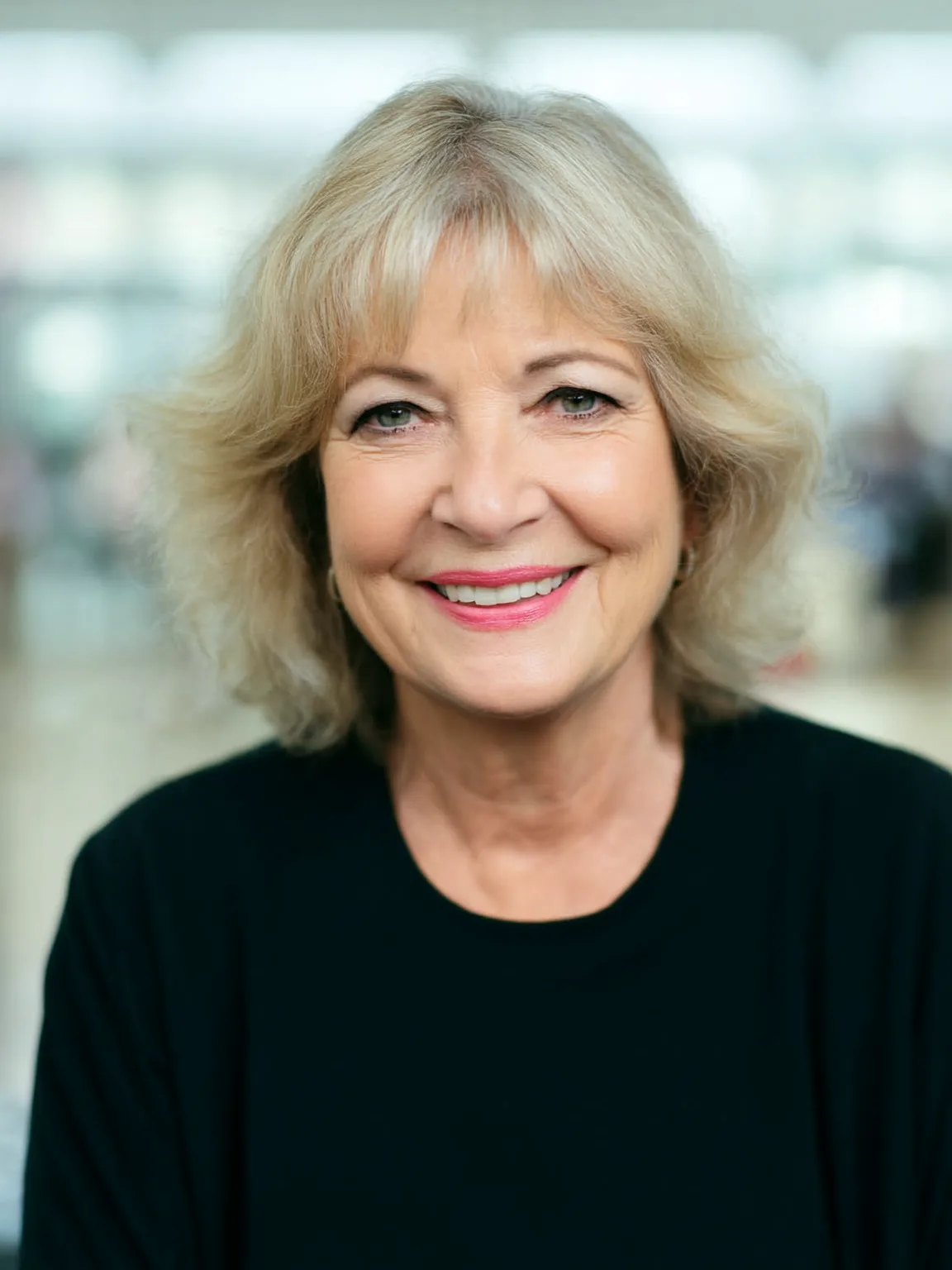 Voluminous Wavy Sandy Blonde Shag with Wispy Bangs