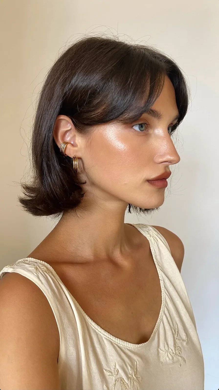 Classic Chin-Length Bob with Sleek Curtain Bangs and Flicked Ends