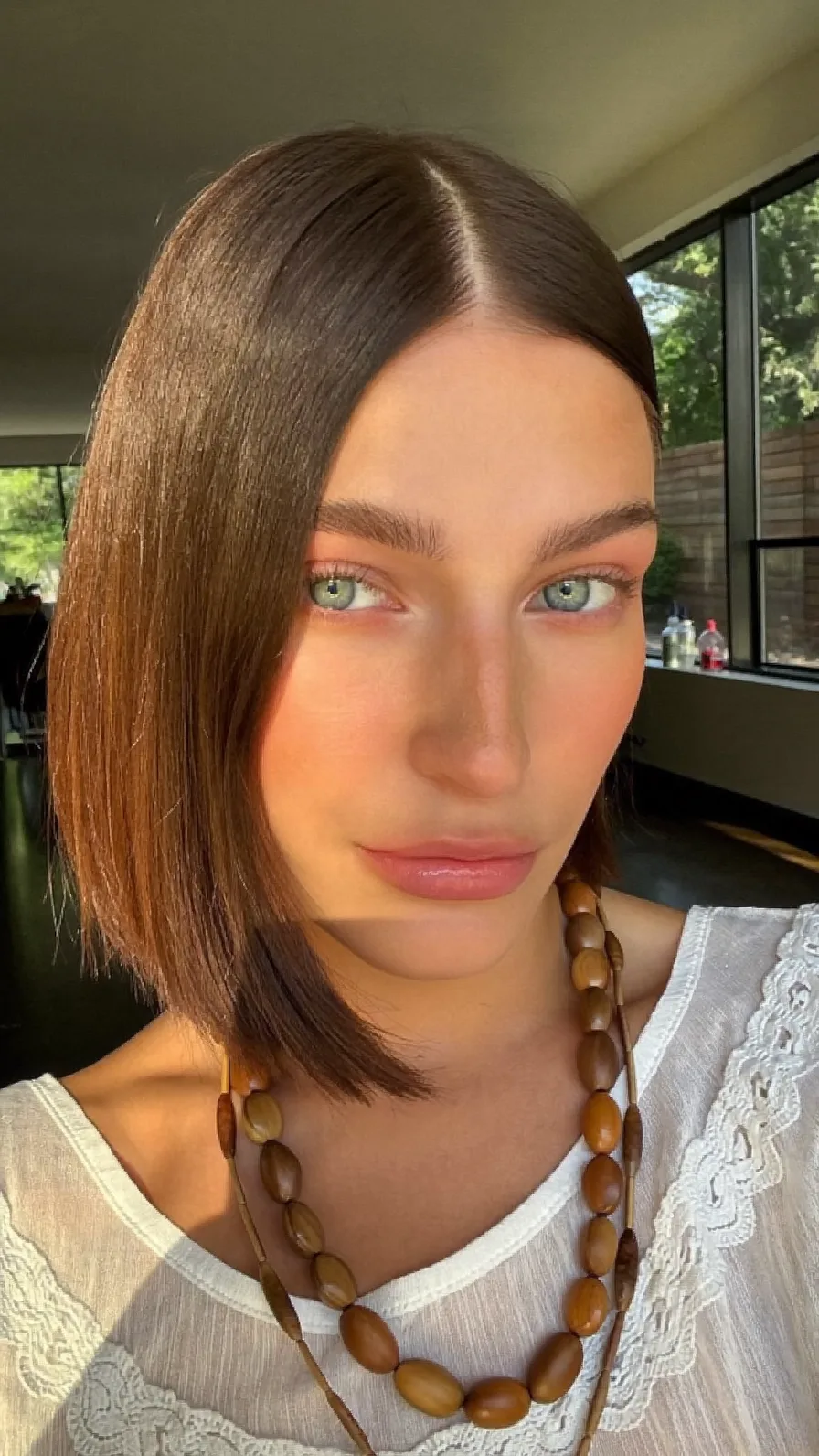 Chic Center-Parted Blunt Chin-Length Brown Bob Hairstyle