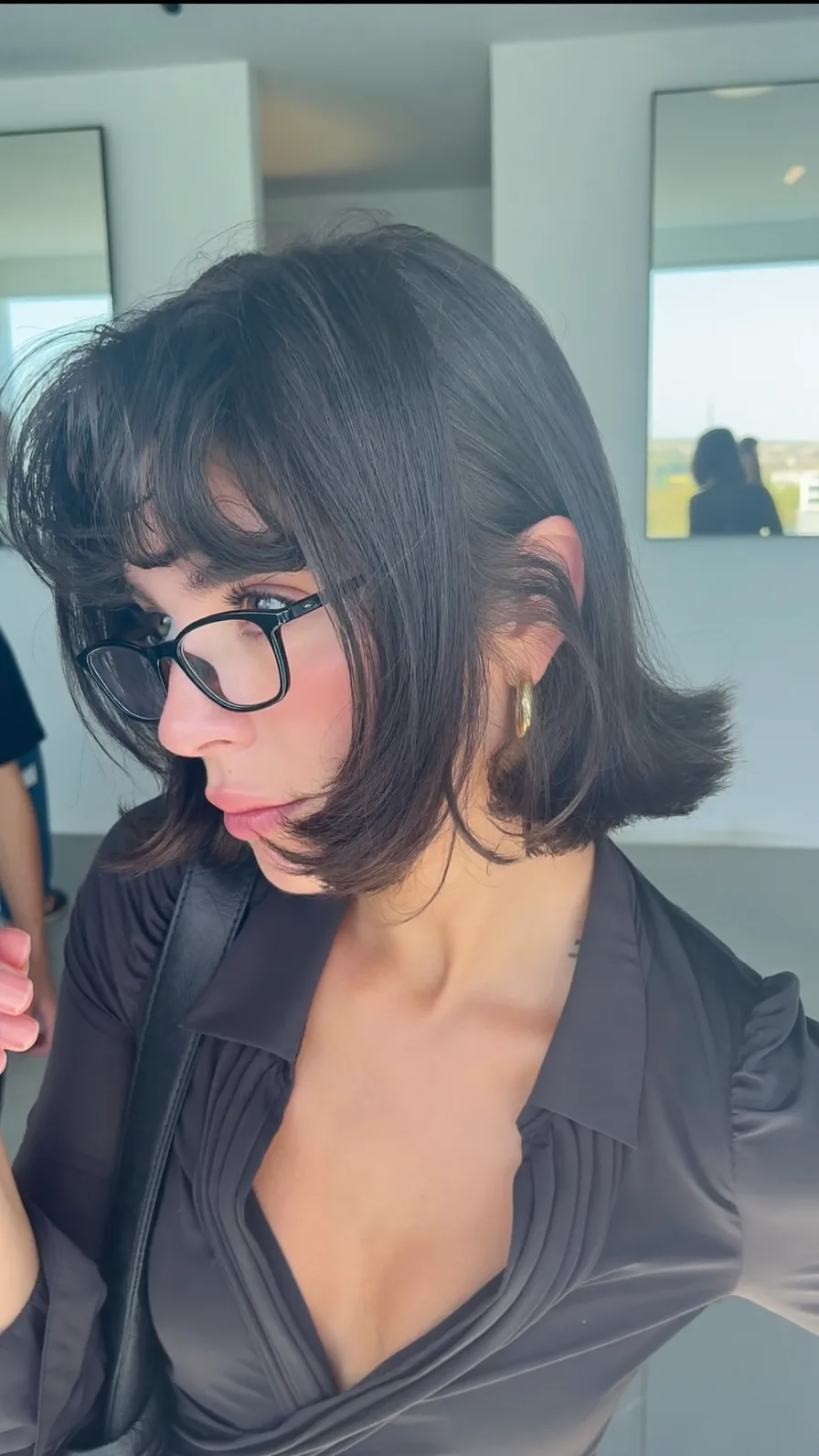 Chic chin-length blunt bob with flowing curtain bangs