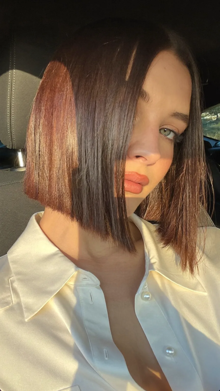 Sleek Blunt Bob with Warm Copper Dimensional Highlights