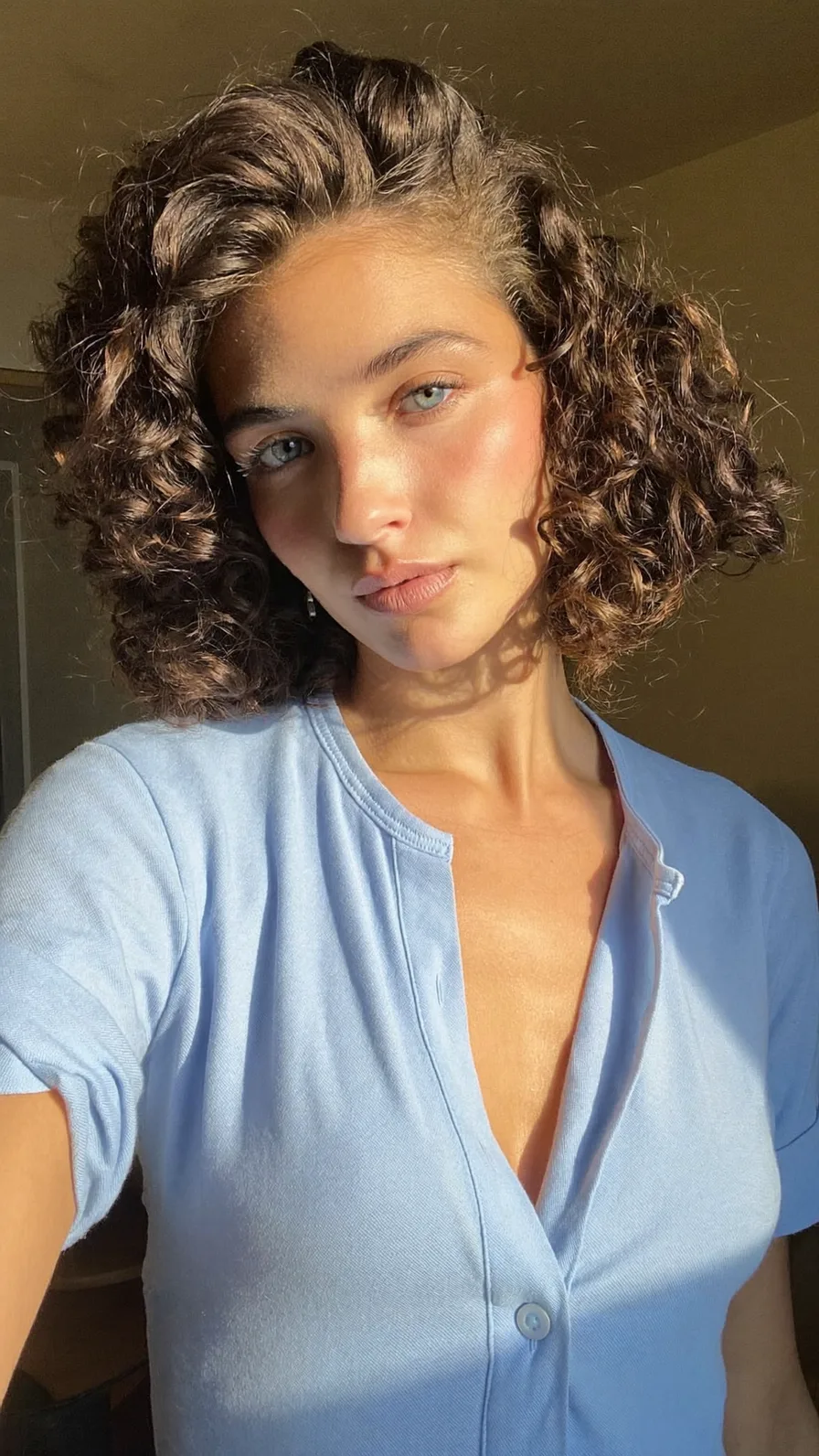 Voluminous Curly Chin-Length Bob with Rounded Ends