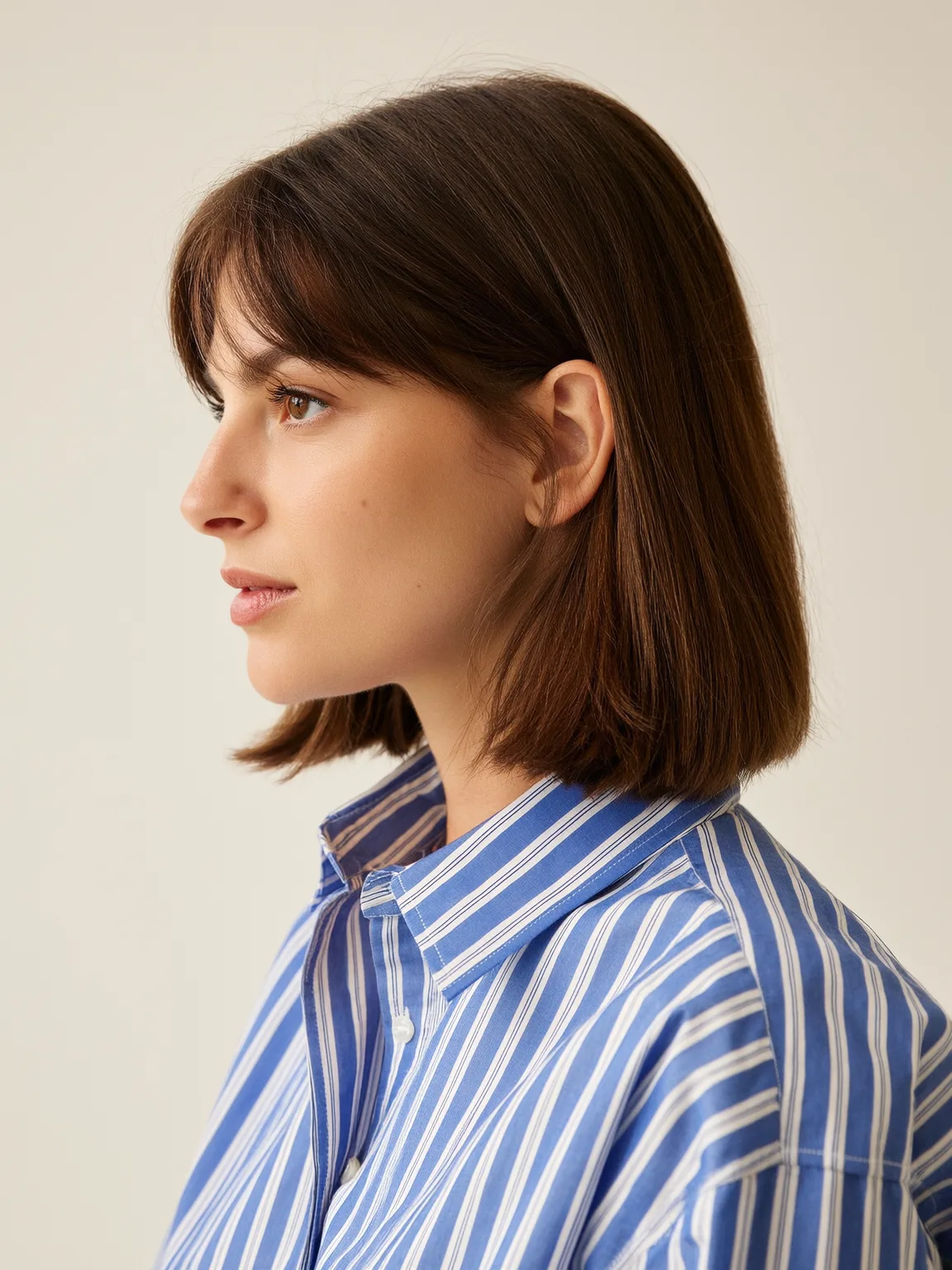 Versatile Chestnut Brown Bob with Curtain Bangs