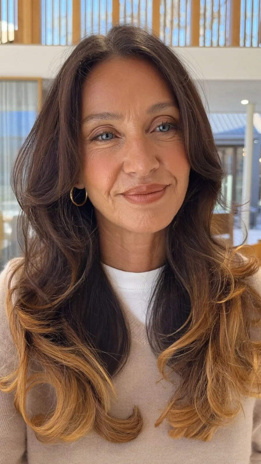 Voluminous Long Layers with Warm Caramel Balayage Ends
