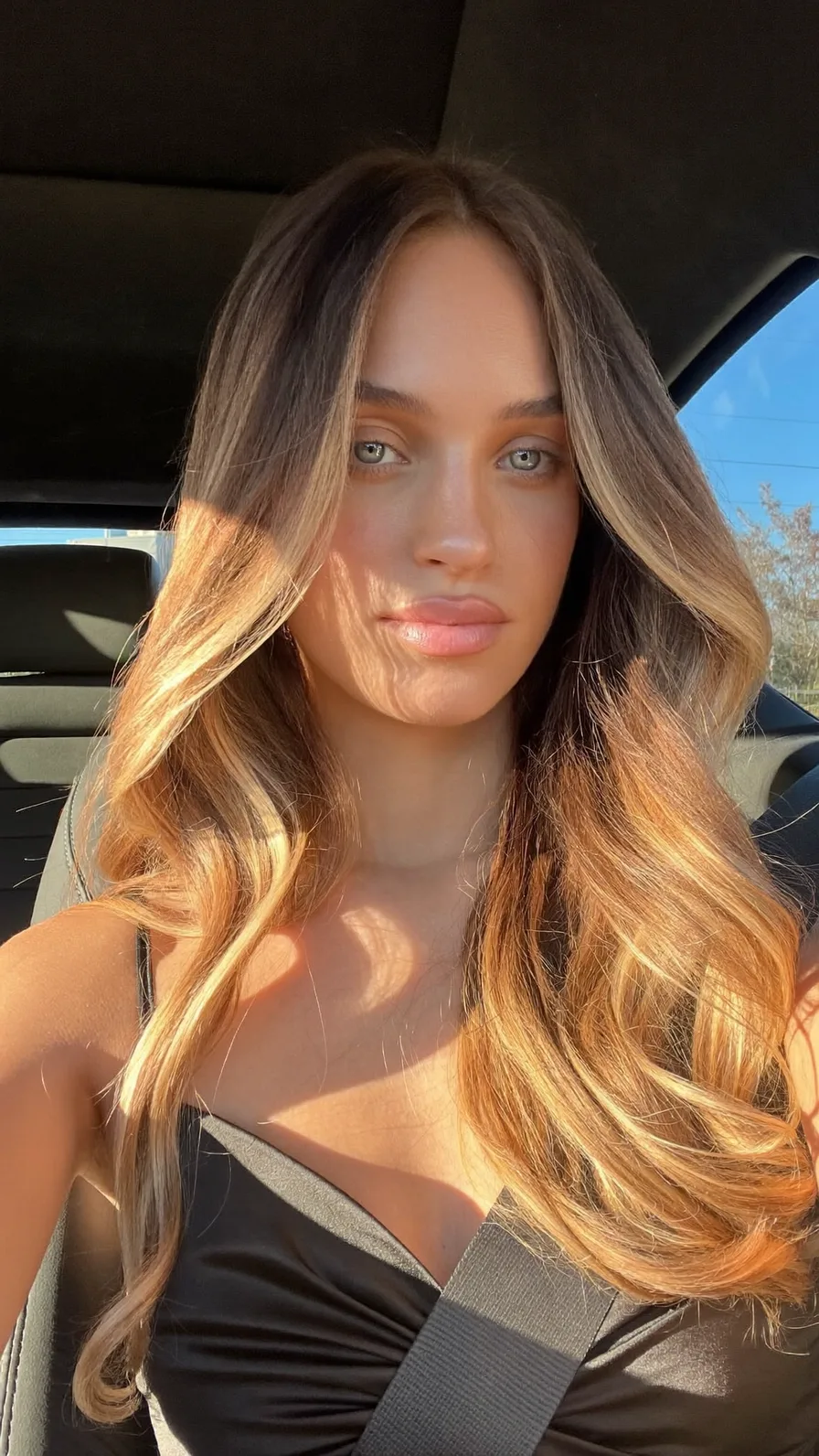Long Layered Hair with Honey Blonde Balayage and Curtain Bangs