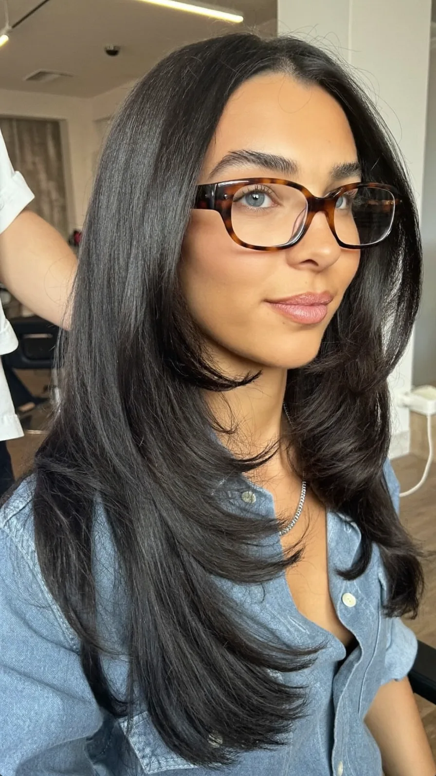 Sleek Long Layers With Center Part And Flicked Ends