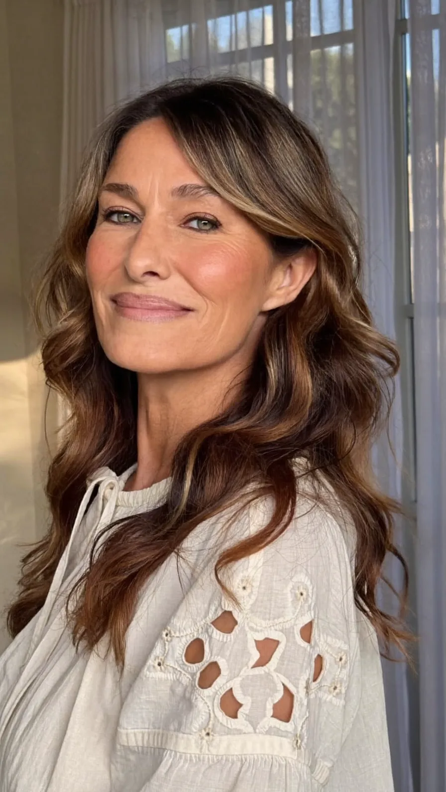 Elegant Long Layers with Caramel Balayage and Curtain Bangs