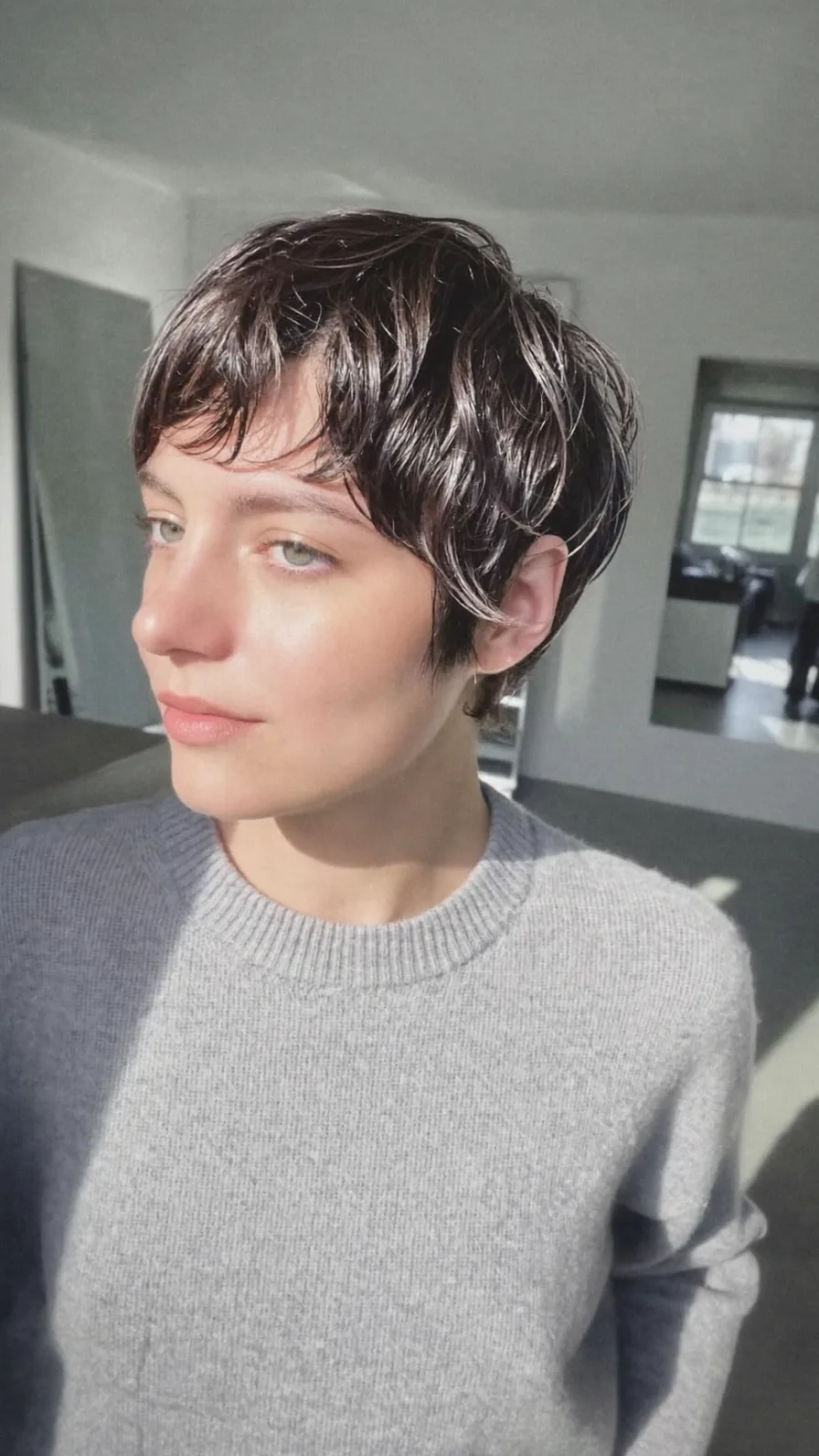 Textured Wavy Pixie Cut with Wispy Side-Swept Bangs