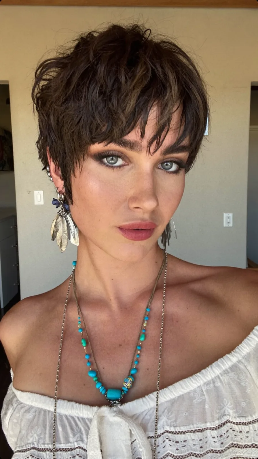 Textured Wavy Pixie Cut with Wispy Layered Bangs