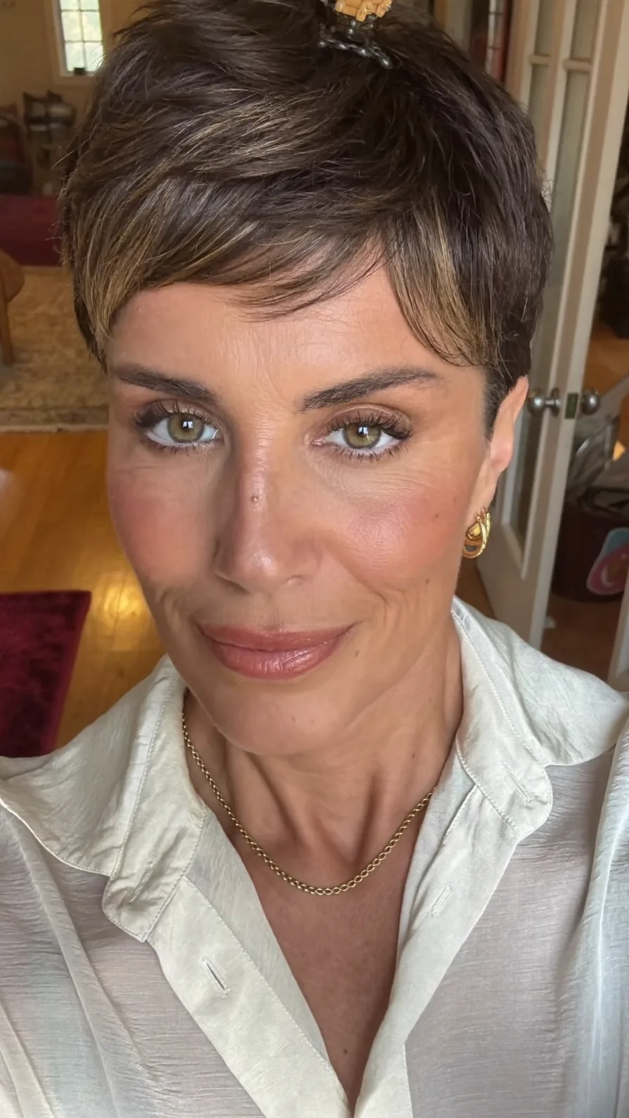 Modern Pixie Cut with Side-Swept Highlights and Textured Layers
